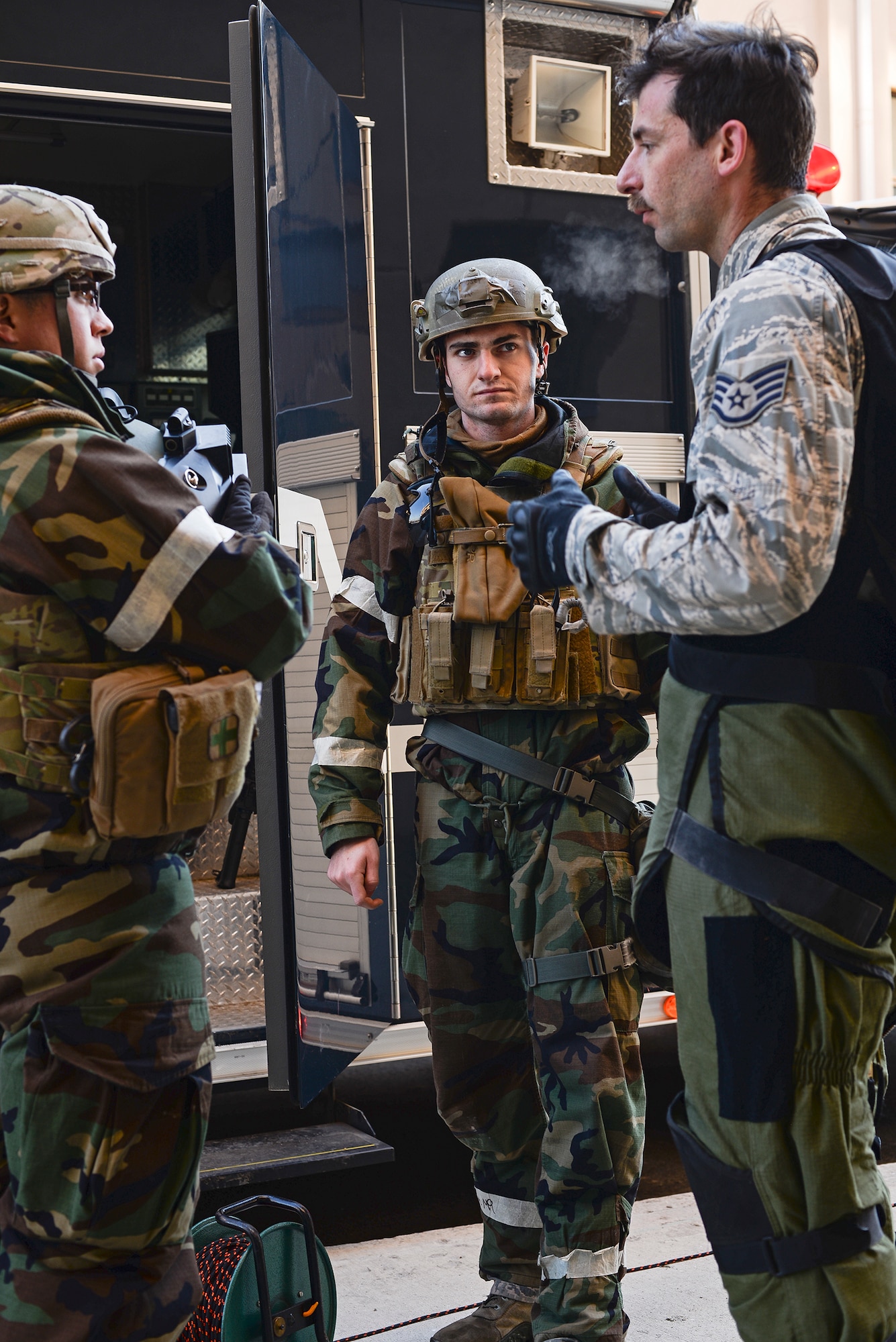 Staff Sgt. Quentin Tubbs, 51st Civil Engineer Squadron Explosive Ordnance Disposal, talks to his teammates after completing a simulated IED diffusal during exercise Beverly Bulldog 15-01 Dec. 9, 2014, at Osan Air Base, Republic of Korea. Beverly Bulldog 15-01 is a peninsula-wide ORE designed to test American forces mission readiness in the event of an emergency or wartime environment.(U.S. Air Force photo by Staff Sgt. Jake Barreiro)