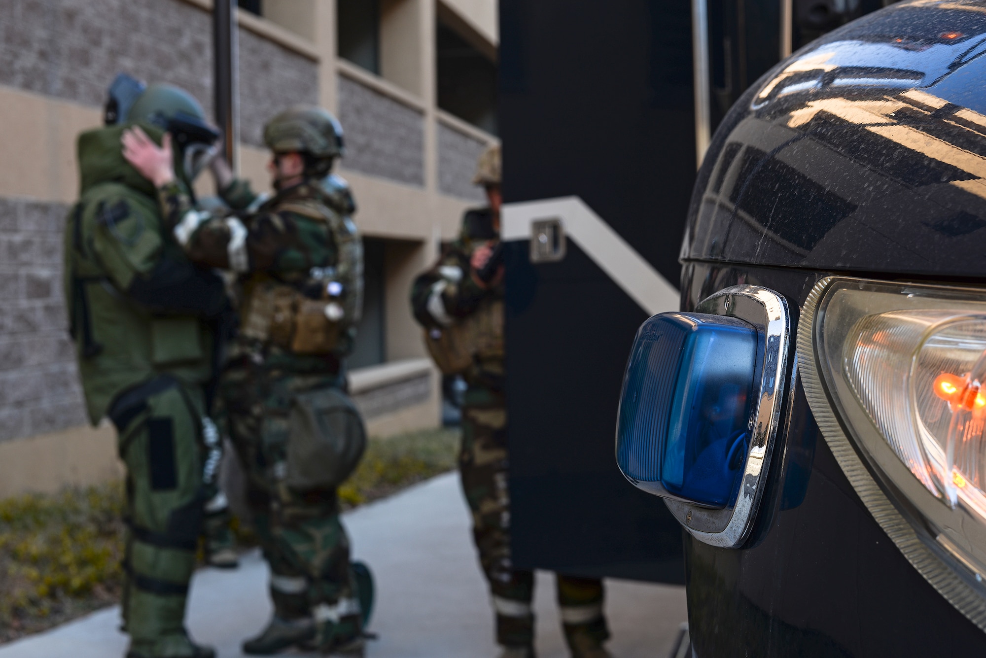 Staff Sgt. Quentin Tubbs, 51st Civil Engineer Squadron Explosive Ordnance Disposal, dons a protective suit during an IED diffusal scenario for exercise Beverly Bulldog 15-01 Dec. 9, 2014, at Osan Air Base, Republic of Korea. Beverly Bulldog 15-1 is a peninsula-wide ORE designed to test American forces mission readiness in the event of an emergency or wartime environment. (U.S. Air Force photo by Staff Sgt. Jake Barreiro)