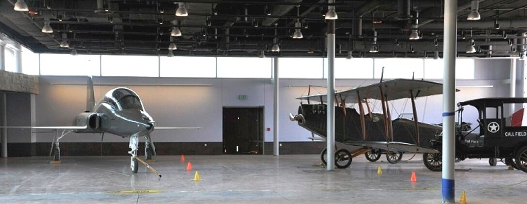 A T-38 Talon from the Euro-NATO Joint Jet Pilot Training program, Sheppard Air Force Base, Texas, sits in the new Wichita Falls Municipal Airport terminal as part of the "Jenny to Jet" heritage of flight exhibit Dec. 1, 2014. Since T-38 suffered nose and undercarriage damage during a landing mishap in 2012, the decision was made to transfer it to the city of Wichita Falls through the government supply process system. A team of more than 60 volunteers from Sheppard worked in their free time from April through October 2014 to restore the aircraft. (U.S. Air Force photo/Debi Smith)   