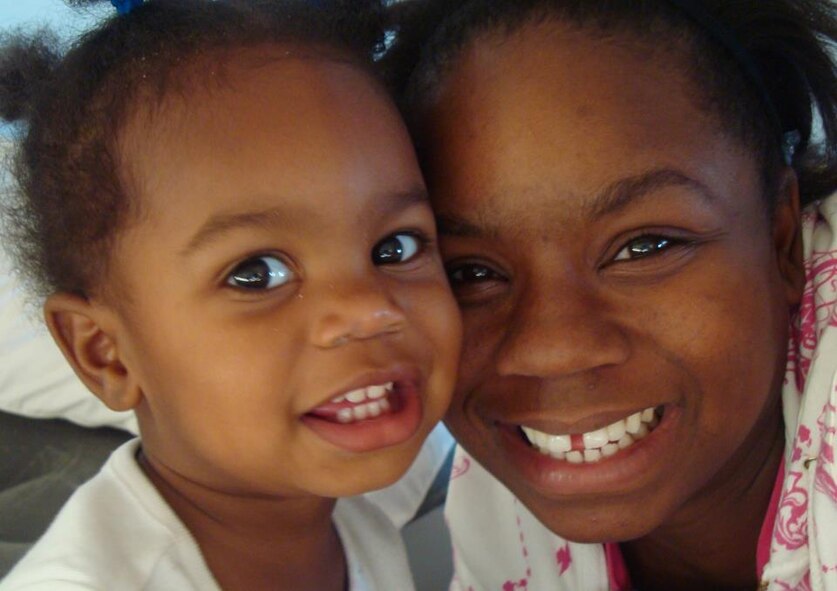 U.S. Air Force Staff Sgt. Courtney Richardson and her first child, Kiana, 1, pose for a photo at her first duty station, Dyess Air Force Base, Texas. Richardson went through the Air Force Assistance Fund for help purchasing a car when she found out she was pregnant and had bad credit. (Courtesy Photo)