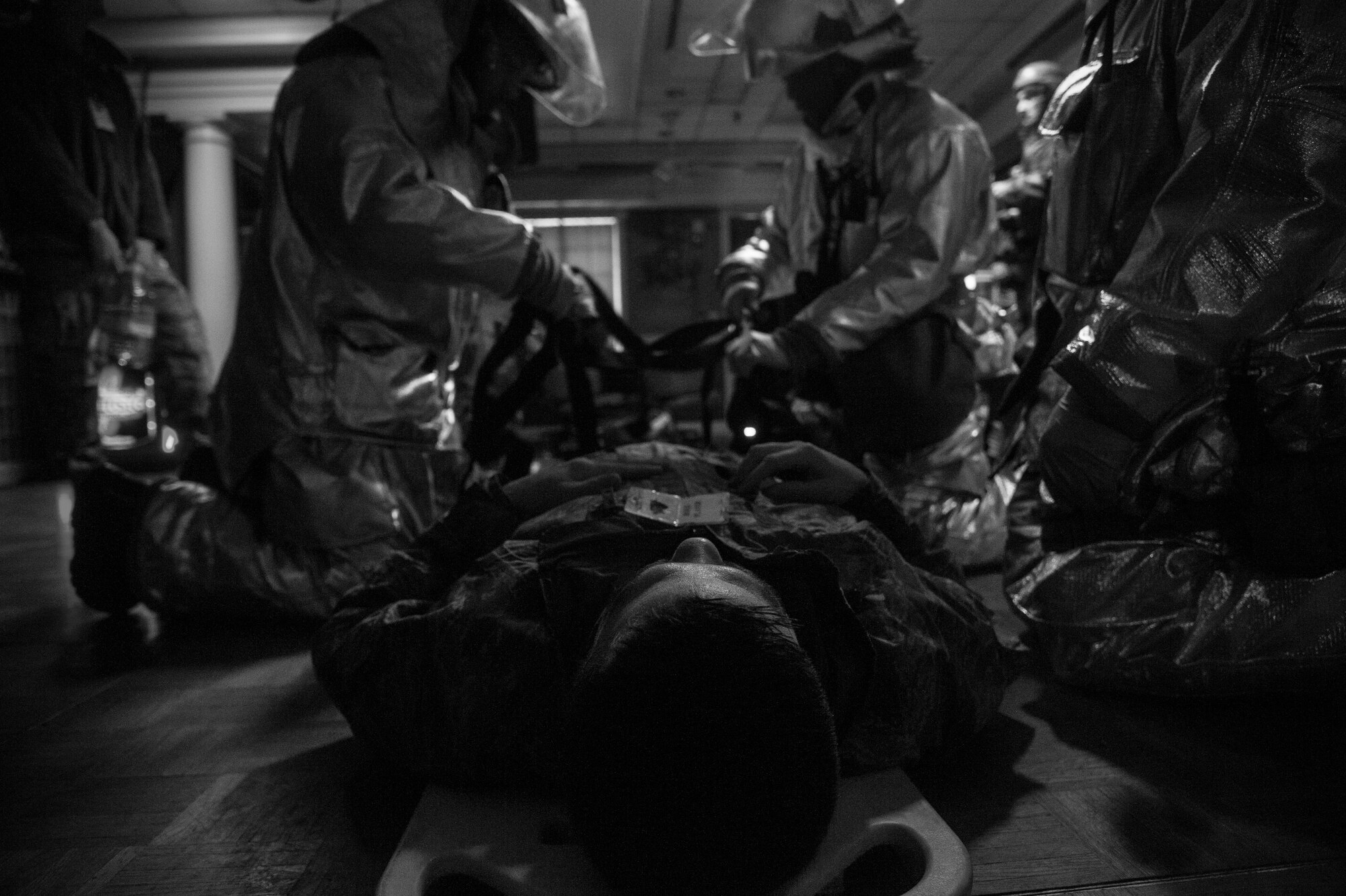 Kunsan firefighters strap a simulated victim of an explosion to a litter during Exercise Beverly Bulldog 15-1 at Kunsan Air Base, Republic of Korea, Dec. 9, 2014. The eight-day exercise took place in an austere environment that tested the Wolf Pack’s ability to respond to wartime and armistice threats. (U.S. Air Force photo by Senior Airman Taylor Curry/Released)