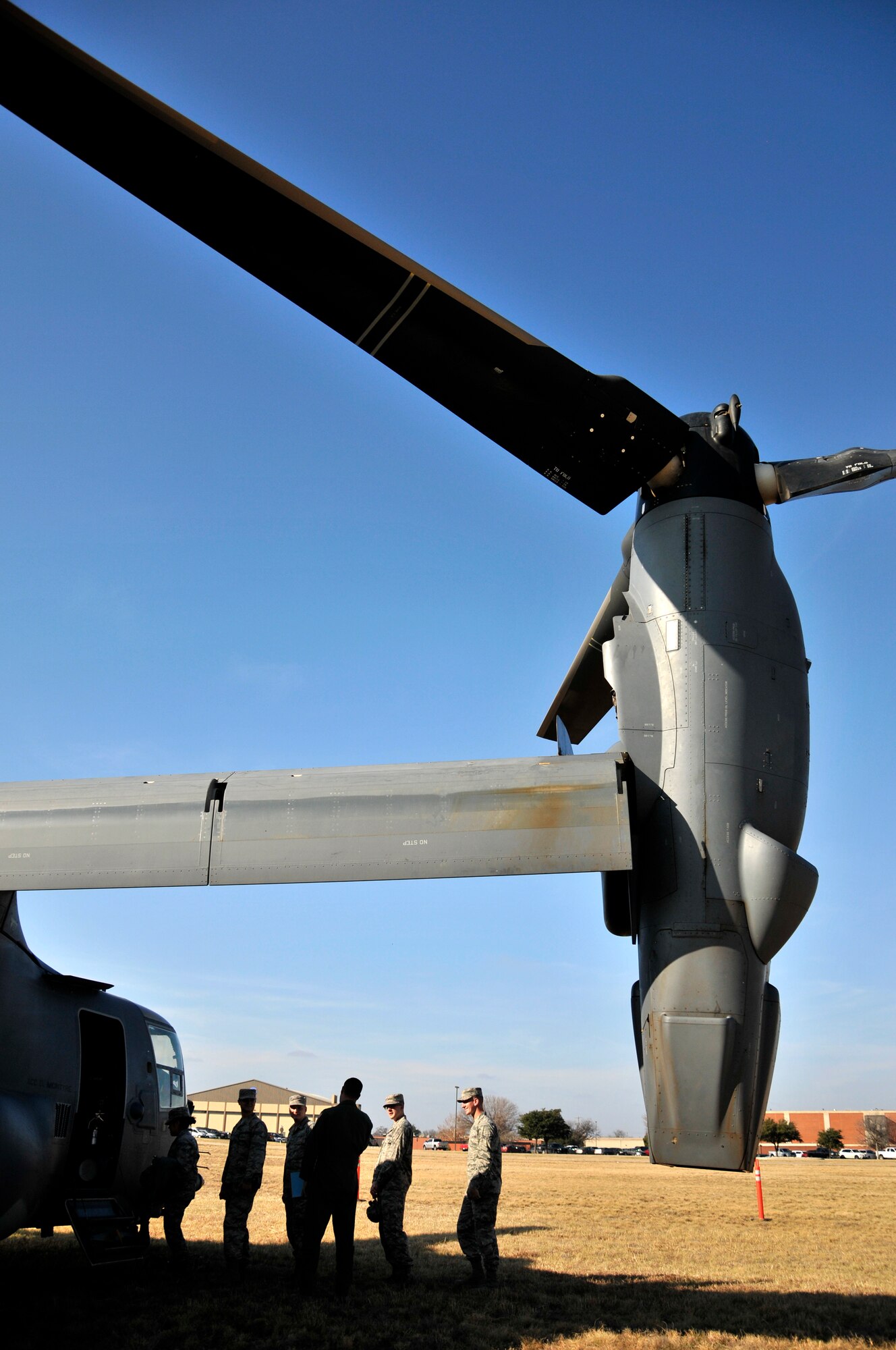 GOODFELLOW AIR FORCE BASE, Texas - 316th Training Squadron students enter a CV-22 Osprey visiting from Cannon Air Force Base Dec. 8. The Osprey brought intelligence personnel from the 20th Operations Squadron back to Goodfellow to give intelligence students first-hand experience with their counterparts in the operational Air Force.  (U.S. Air Force photo/ Airman First Class Scott Jackson)