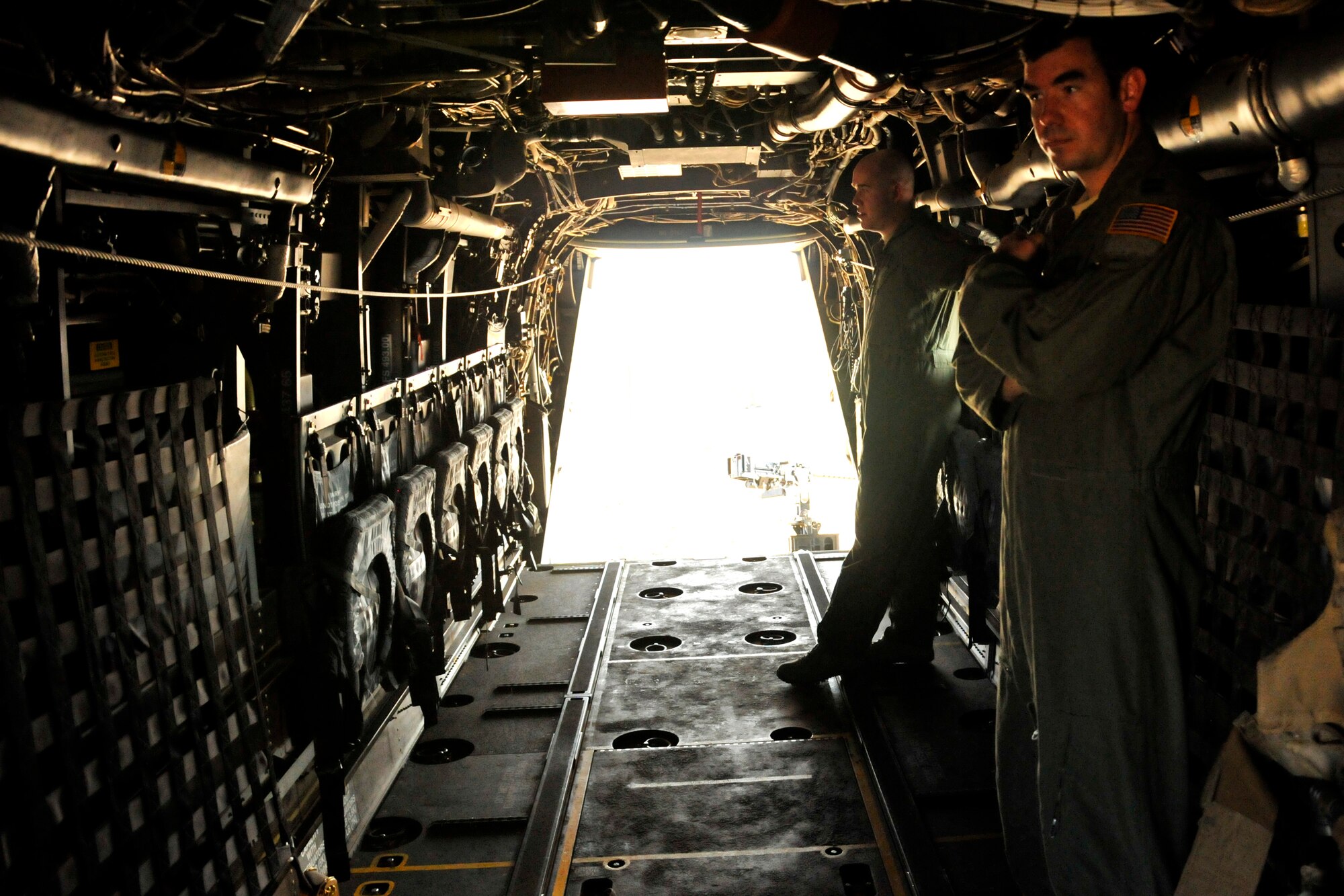 GOODFELLOW AIR FORCE BASE, Texas - Staff Sgt. Andrew D. Lanham, 20th Special Operations Squadron CV-22 flight engineer, and Capt. Jim R. Kolasa, 20th Special Operations Squadron CV-22 pilot, stand inside a CV-22 Osprey during a visit to Goodfellow Dec. 8. The Osprey brought intelligence personnel from the 20th Operations Squadron back to Goodfellow to give intelligence students first-hand experience with their counterparts in the operational Air Force.  (U.S. Air Force photo/ Airman First Class Scott Jackson)