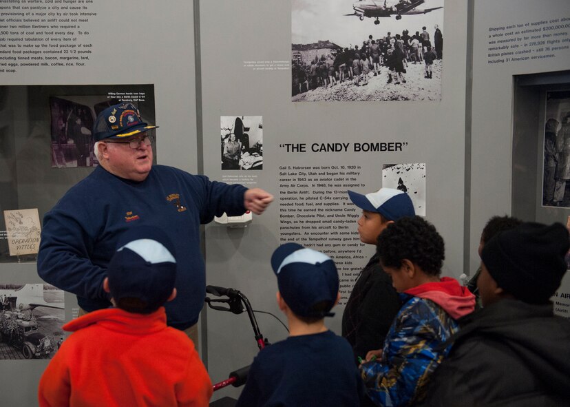 Bill Maroon, volunteer tour guide, gives a guided tour to a group of Boy Scouts Nov. 15, 2014, at the AMC Museum on Dover Air Force Base, Del. Maroon is one of 170 volunteers who work at the museum. (U.S. Air Force photo/Airman 1st Class Zachary Cacicia)  
