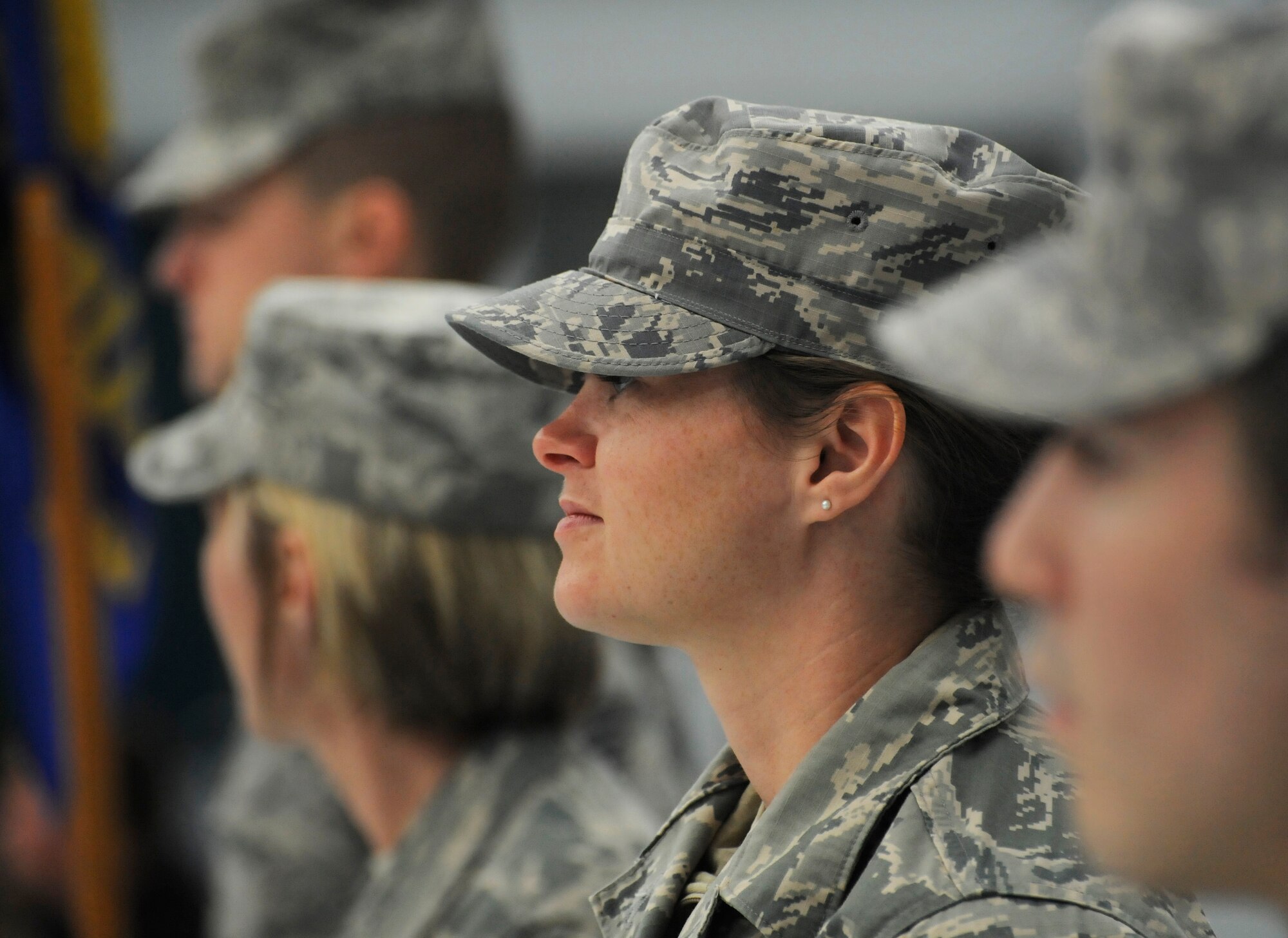 Oregon Staff Sgt. Alicia Tishmack, assigned to the 142nd Fighter Wing Civil Engineer Squadron, stands in formation and listens to remarks during the Demobilization Ceremony for the 142nd Fighter Wing Civil Engineer Squadron and Security Forces Squadron at the Portland Air National Guard Base, Ore., Dec. 7, 2014. (U.S. Air National Guard photo by Tech. Sgt. John Hughel, 142nd Fighter Wing Public Affairs/Released)