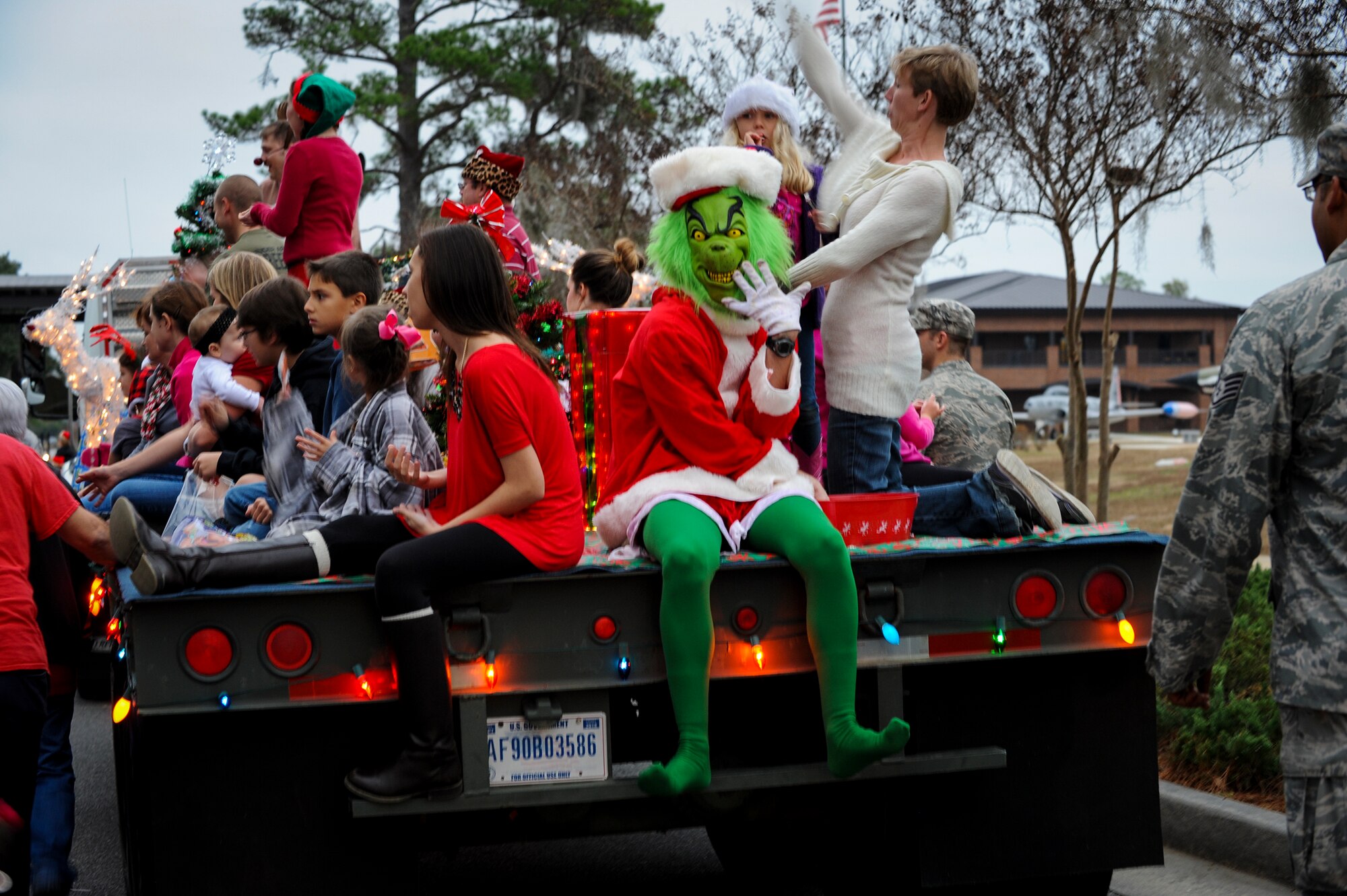 The Grinch poses menacingly for a photo during a parade at the Annual Base Tree Lighting and Holiday Parade Dec. 5, 2014 at Moody Air Force Base, Ga. The parade also featured appearances by the base leadership, 23d Civil Engineer Squadron fire department, Green Knight members, Santa Claus and more. (U.S. Air Force photo by Andrea Jenkins/Released)