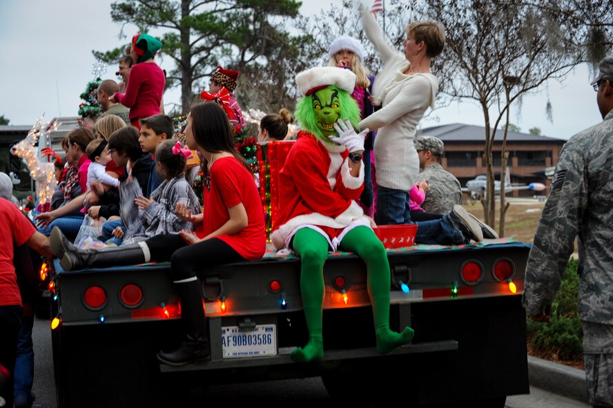 The Grinch poses menacingly for a photo during a parade at the Annual Base Tree Lighting and Holiday Parade Dec. 5, 2014 at Moody Air Force Base, Ga. The parade also featured appearances by the base leadership, 23d Civil Engineer Squadron fire department, Green Knight members, Santa Claus and more. (U.S. Air Force photo by Andrea Jenkins/Released)