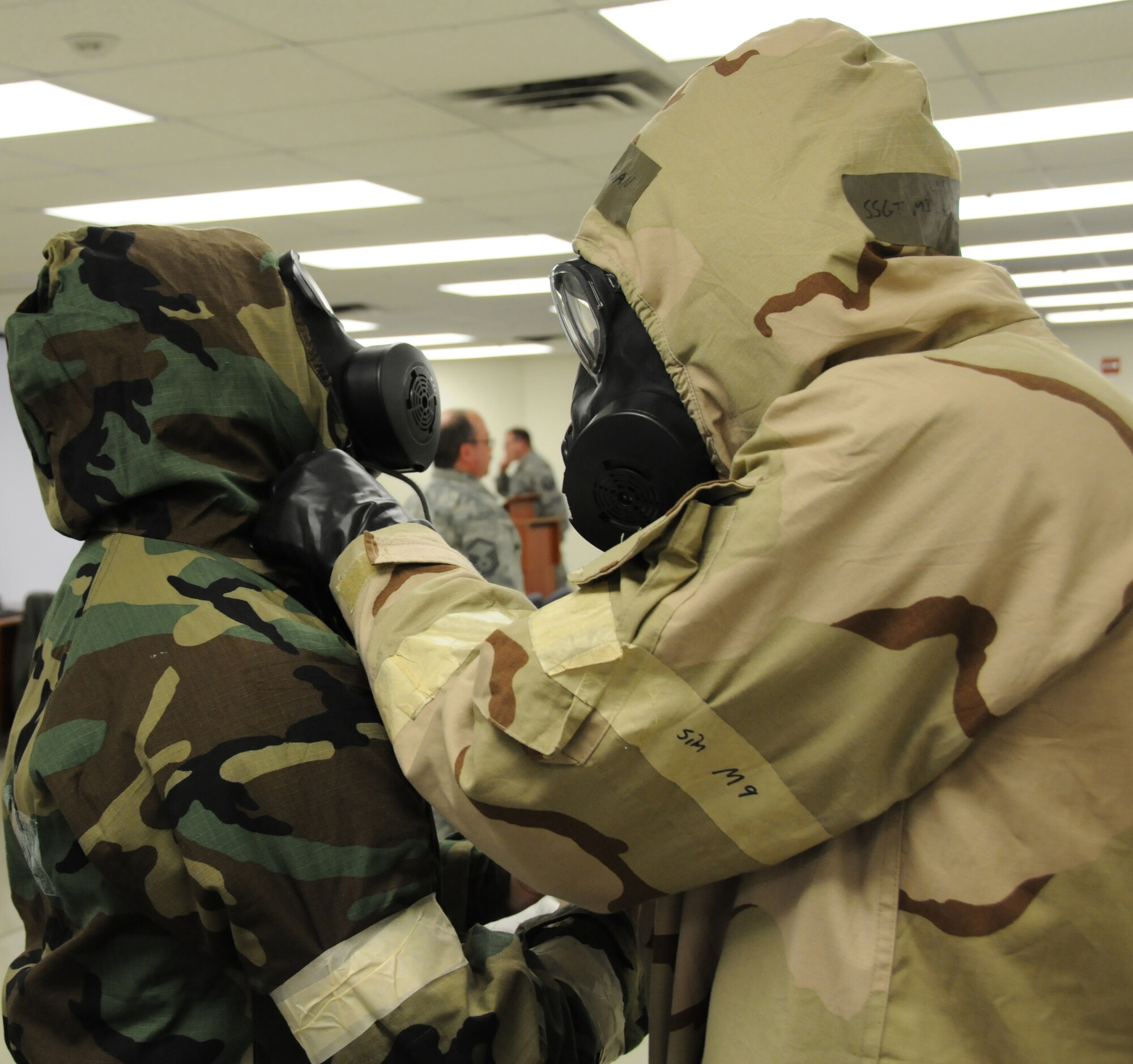 192D Civil Engineering Squadron conducts “ATSO Rodeo” training for Airmen who will provide “ATSO” training to unit members preparing for exercises and future deployments.  These members will augment the civil engineering trainers by teaching unit members how to successfully prepare, deploy and operate in a Chemical, Biological, Radiological, Nuclear, and Explosive (CBRNE) environment. Tech. Sgt. Michael Geoghean, fuel systems technician, Staff Sgt. Andrew Buzas, aviation resource management, 149th FS and Tech. Sgt. Debra McCarley, munitions technician, MXS Ammo dress out in level four MOPP gear as part of the training to prepare them to be qualified instructors. (U.S. Air National Guard photo by Airman 1st Class Johnisa B. Roberts/Released)