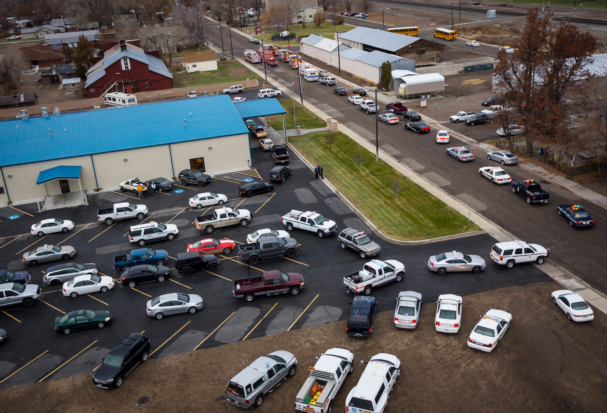 Dozens of police cars file in behind school busses and fire trucks headed to Walmart in Mountain Home, Idaho, Dec. 6, 2014. The busses and some of the emergency vehicles transported children participating in the "Shop with a Cop" event to help underprivileged youth. (Courtesy photo by Samuel Morse)