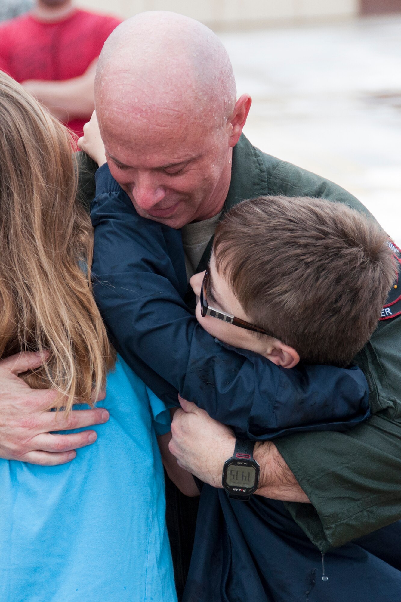 It's hugs and kisses for U.S. Air Force Col. Jonathan Ellis, 307th Bomb Wing commander, as he is greeted by his children after returning from his final flight in a B-52H Stratofortress, Dec. 5, 2014, Barksdale Air Force Base, La. Ellis took command of the wing on Feb. 11, 2012 and relinquished command on Dec. 5, 2014. (U.S. Air Force photo by Tech. Sgt. Ted Daigle/Released)
