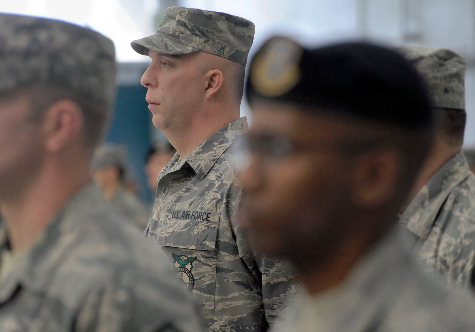 Oregon Master Sgt. Kyle Nelson, assigned to the 142nd Fighter Wing Civil Engineer Squadron, stands in formation and listens to remarks by Kate Brown, Oregon Sec. of State, during the Demobilization Ceremony for the 142nd Fighter Wing Civil Engineer Squadron and Security Forces Squadron at the Portland Air National Guard Base, Ore., Dec. 7, 2014. (U.S. Air National Guard photo by Tech. Sgt. John Hughel, 142nd Fighter Wing Public Affairs/Released)