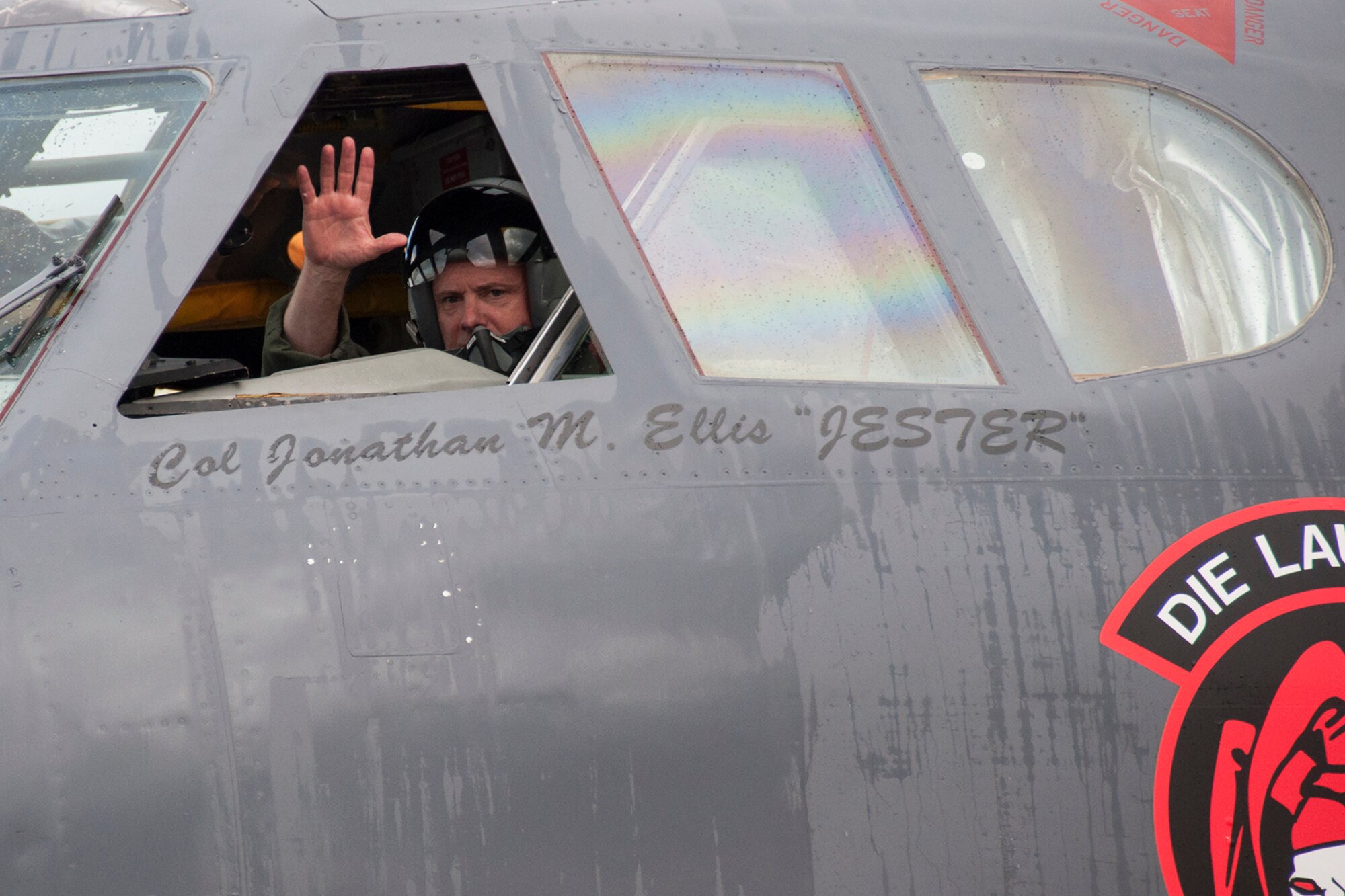 U.S. Air Force Col. Jonathan Ellis, 307th Bomb Wing commander, gives a wave after touching down from his final flight on a B-52H Stratofortress, Dec. 5, 2014, Barksdale Air Force Base, La. This marked the last flight for Ellis who relinquished command of the wing on Dec. 7, 2014.  (U.S. Air Force photo by Tech. Sgt. Ted Daigle/Released)