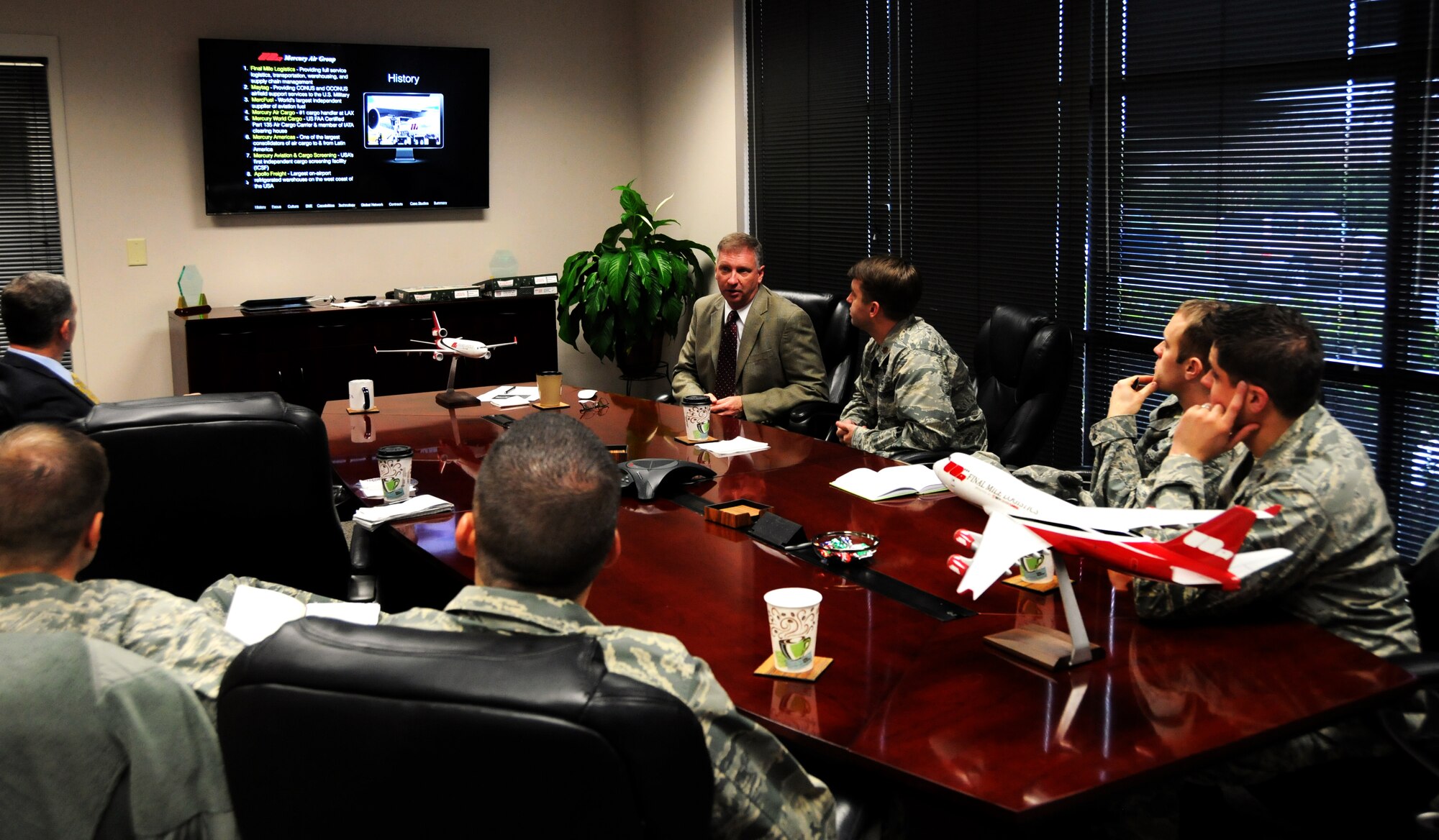 Mark Gordon, Contingency Operations director for Final Mile Logistics, speaks to Air Force Fellows at the FML facility in Atlanta, Ga., Dec. 8, 2014. Five majors from AMC came to the Atlanta area Dec. 8 through 10 to speak to civilian business leaders as part of the Joint Mobility Fellowship Program. (U.S. Air Force photo by Senior Airman Daniel Phelps)