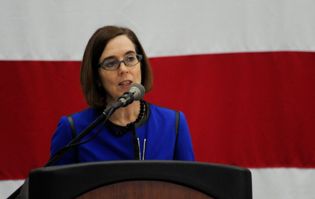Kate Brown, Oregon Secretary of State, addresses service members, families and dignitaries in attendance at the Demobilization Ceremony for the 142nd Fighter Wing Civil Engineer Squadron and Security Forces Squadron at the Portland Air National Guard Base, Ore., Dec. 7, 2014. (U.S. Air National Guard photo by Tech. Sgt. John Hughel, 142nd Fighter Wing Public Affairs/Released)