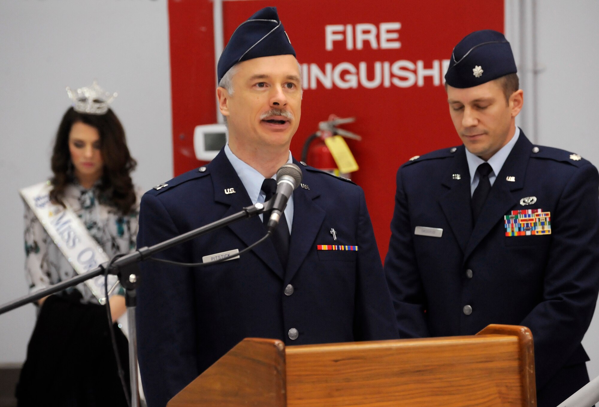 Capt. Rory Pitstick, 142nd Fighter Wing Chaplin, delivers the invocation at the Demobilization Ceremony for the 142nd Fighter Wing Civil Engineer Squadron and Security Forces Squadron at the Portland Air National Guard Base, Ore., Dec. 7, 2014. (U.S. Air National Guard photo by Tech. Sgt. John Hughel, 142nd Fighter Wing Public Affairs/Released))