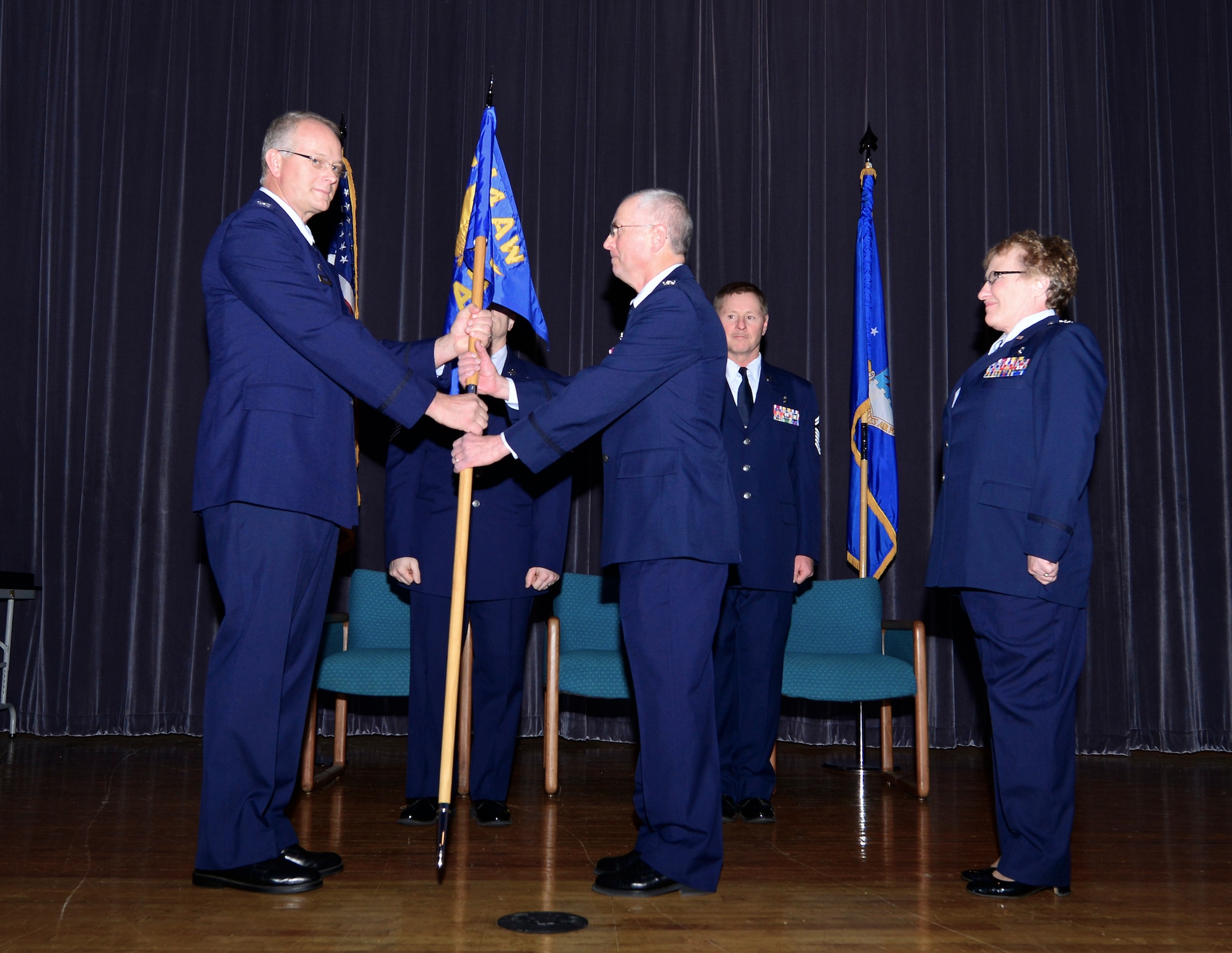 Col. Victor D. Brown (right) assumes command of the 914th Aeromedical Staging Squadron from Col. Steven Parker at Niagara Falls Air Reserve Station, Oct. 4, 2014. Prior to commanding the 914th Aeromedical Staging Squadron, Brown served the 914th Airlift Wing as Chief of Dental Services, and replaces Col. Catherine Hallett (far right). (U.S. Air Force photo by Staff Sgt. Stephanie Sawyer)