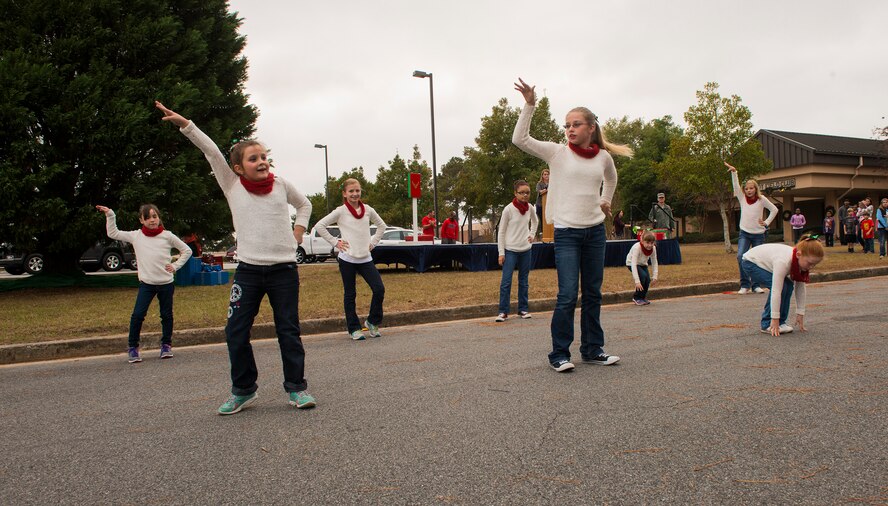 Moody Youth Programs’ dancers perform a routine during the Annual Tree Lighting Ceremony and Holiday Parade Dec. 5, 2014, at Moody Air Force Base, Ga. The dancers practiced the routine for a month to perform to with Christmas music in front of the crowd. (U.S. Air Force photo by Airman 1st Class Ceaira Tinsley/Released)