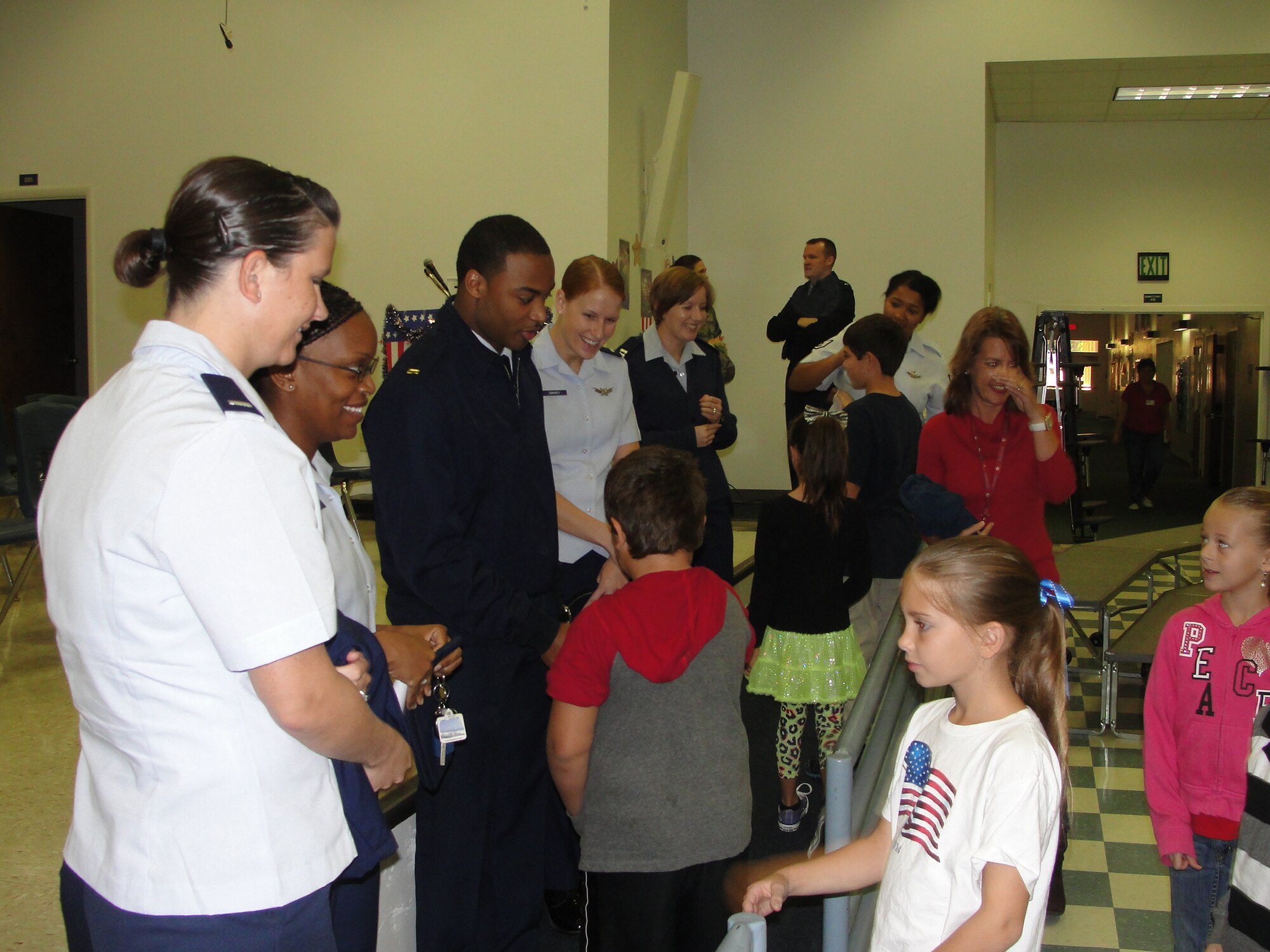 FREEPORT, Fla. -- Airmen from the 20th Space Control Squadron greet students at the Freeport Elementary School’s annual Veterans Day program Nov. 7. (Photo courtesy Freeport Elementary School)