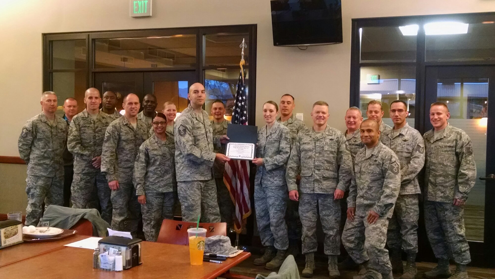 PETERSON AIR FORCE BASE, Colo. – Staff Sgt. Krisinda McCoy, 21st Logistics Readiness Squadron NCOIC of Passenger Travel, received the Diamond Sharp Award from the Team Peterson First Sergeant Council Dec. 3. McCoy provided passenger movement support for various agencies including the 21st and 50th Space Wings, Headquarters Air Force Space Command, and NORAD/NORTHCOM, for 475 deployers as well as 220 personnel PCSing from the Peterson complex last quarter. McCoy briefs passengers on travel entitlements, flight itineraries, pet shipments, baggage allowances and monitors airline ticket reservations created by the Commercial Travel Office. Additionally, McCoy was an honor guard team leader and trainer, training 45 personnel over a four month span, and leading 29 color guard details, 12 flag folding ceremonies, and 10 military and veteran funerals. (U.S. Air Force photo)