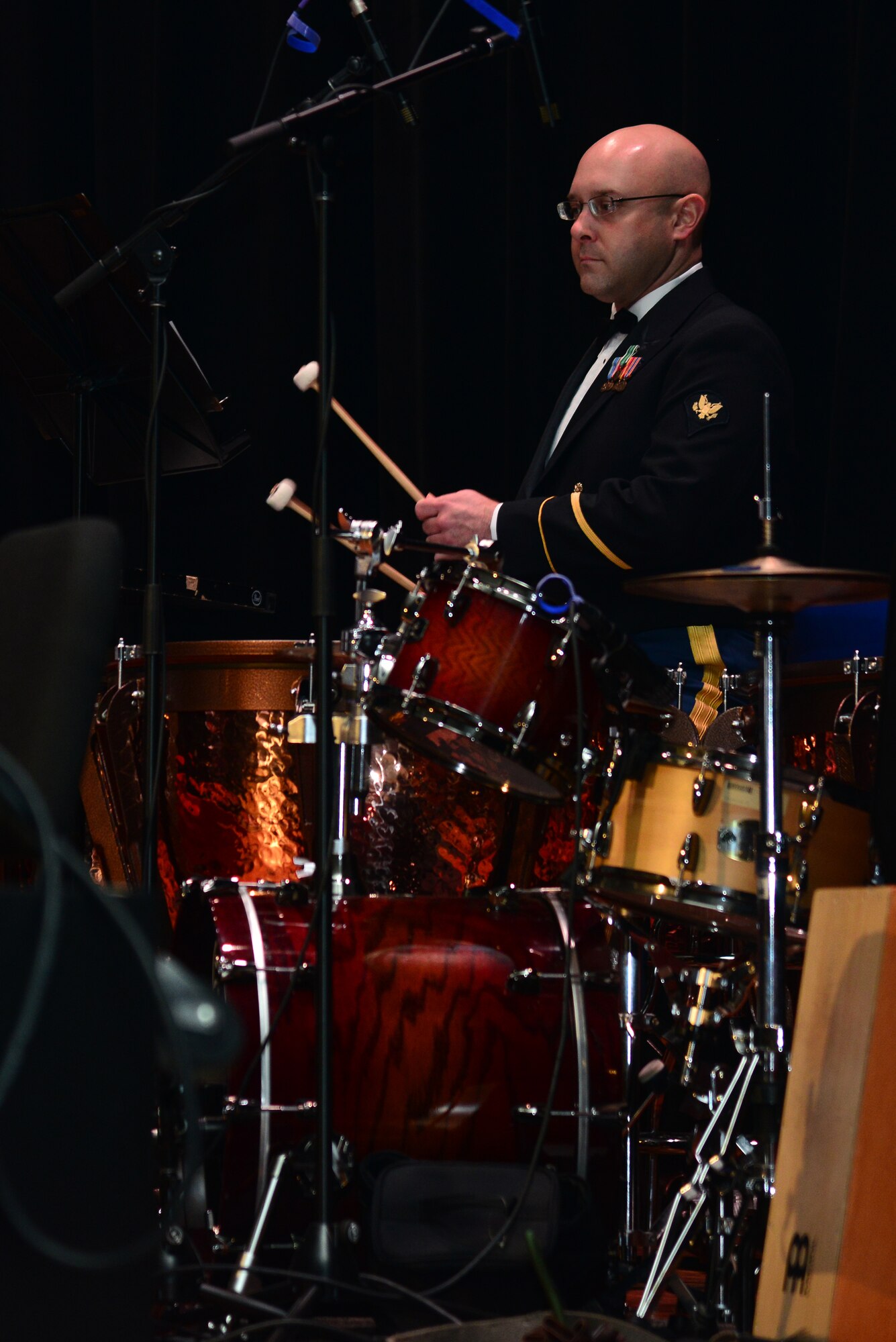 U.S. Army Spc. William Scott, Training and Doctrine Command Band percussionist, plays tympani drums during the “Celebrate the Holidays!” concert series at Fort Eustis, Va., Dec. 7, 2014. The band performed for crowds, free-of-charge, in Norfolk, Newport News and Williamsburg, Va., Dec. 6, 7 and 9. (U.S. Air Force photo by Senior Airman Aubrey White/Released) 