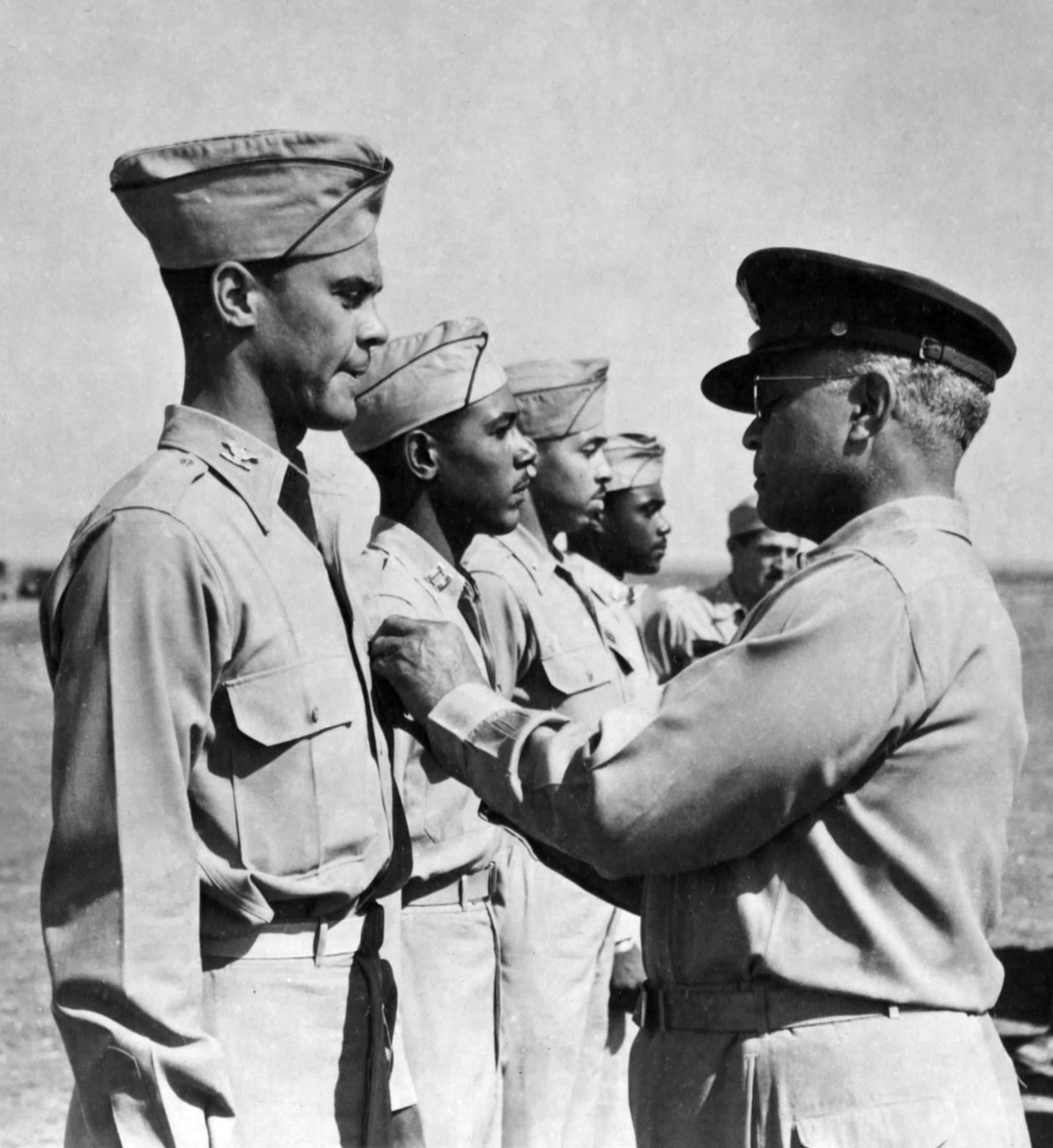 Brig. Gen. Benjamin O. Davis pins the Distinguished Flying Cross on his son, Col. Benjamin O. Davis Jr. (U.S. Air Force photo)