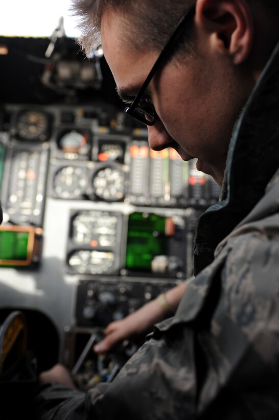 Senior Airman James Earnst, 37th Aircraft Maintenance Unit communication, navigation and mission systems journeyman, removes the radar altimeter control panel of a B-1 bomber for inspection during regular maintenance at Ellsworth Air Force Base, S.D., Dec. 3, 2014. Communication, navigation and mission systems Airmen routinely troubleshoot and repair various systems in the bomber to ensure the pilots are able to communicate with forces on the ground to effectively execute the.  (U.S. Air Force photo by Senior Airman Hailey R. Staker/Released)