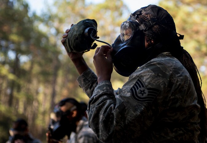 Technical Sgt. Chiquita Frazier, 628th Logistics Readiness Squadron flight service center NCOIC, stays hydrated during a chemical, biological, radiological, nuclear and high-yield explosives training course Dec. 3, 2014, at Joint Base Charleston, S.C. After Air Force Basic military training, active-duty Airmen are required to go through CBRNE refresher training every two years. (U.S. Air Force photo/Senior Airman Marianique Santos)