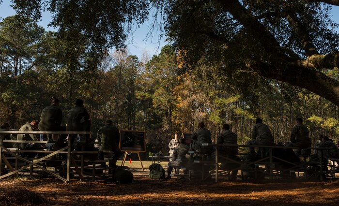 Airman 1st Class Gregory Emond, 628th Civil Engineer Squadron emergency management apprentice, instructs Airmen on mission-oriented, protective gear during a chemical, biological, radiological, nuclear and high-yield explosives training course Dec. 3, 2014, at Joint Base Charleston, S.C. After Air Force Basic military training, active-duty Airmen are required to go through CBRNE refresher training every two years. (U.S. Air Force photo/Senior Airman Marianique Santos)