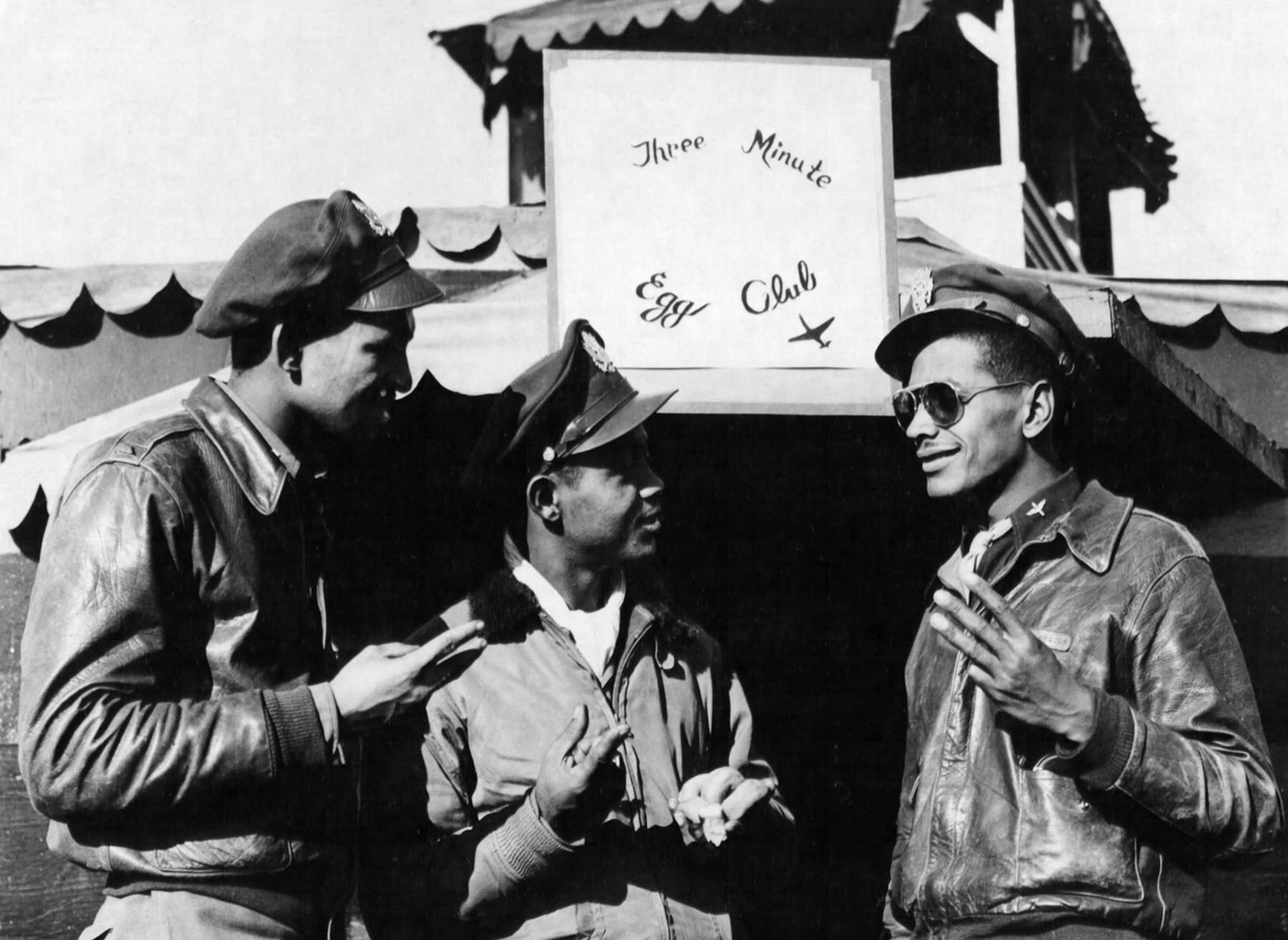Long, dangerous missions over enemy territory and bad weather sometimes meant that pilots returned to base with enough gas for just three minutes of flying time -- the time it takes to boil an egg. Some Tuskegee Airmen decided to form the “Three Minute Eggs Club,” with membership limited to those who landed within the narrow margin. Left to right are 1st Lt. Clarence W. Dart, 1st Lt. Wilson Eagleson, II and 2nd Lt. William Olsbrook (October 1944). (U.S. Air Force photo)