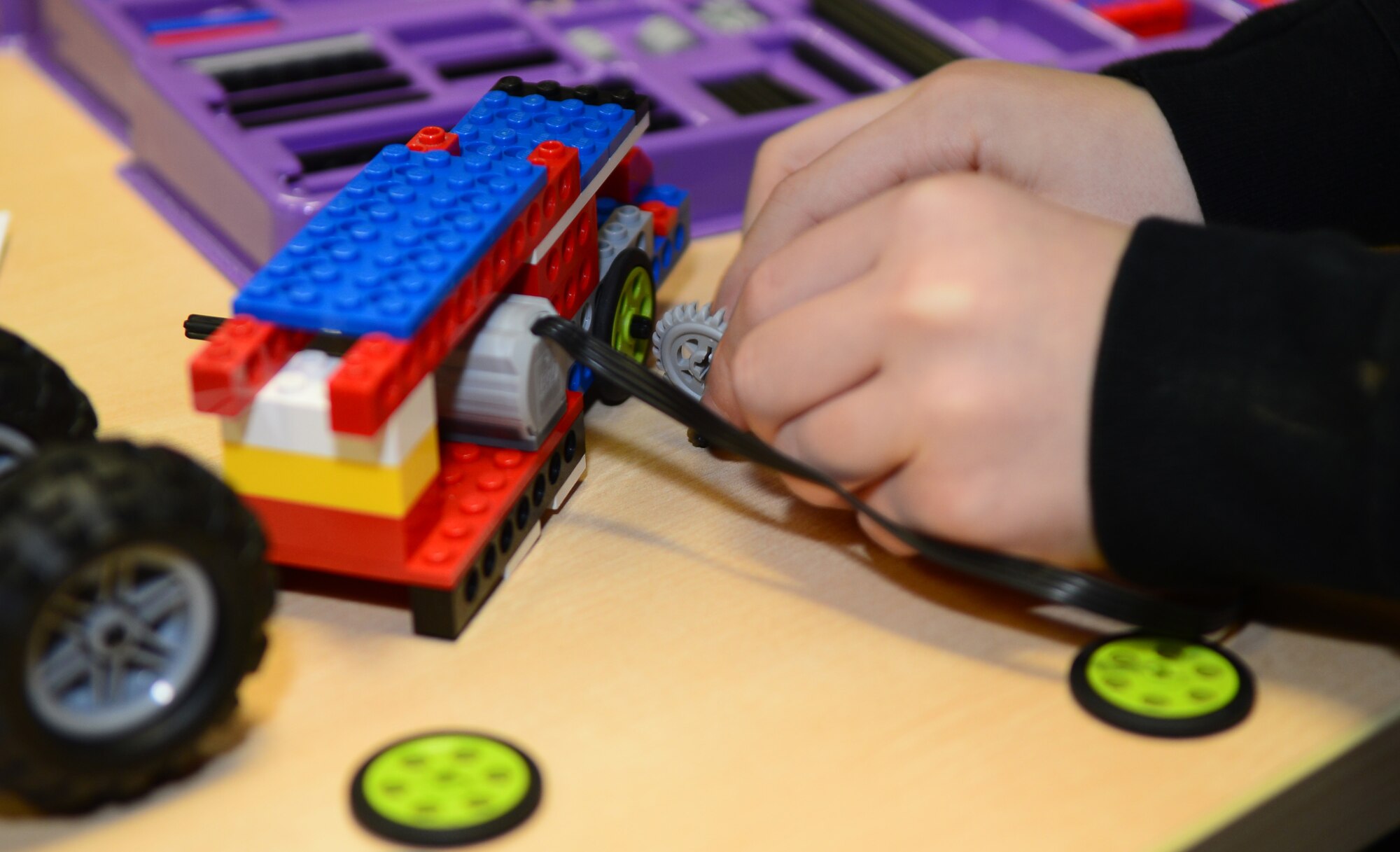 A Team Mildenhall child plays with building blocks during the Young Engineer Camp Dec. 6, 2014, at the Airman and Family Readiness Center on RAF Mildenhall, England. The camp was designed to give RAF Mildenhall’s exceptional family members a friendly learning environment with peers of similar interest. (U.S. Air Force photo by Airman 1st Class Jonathan Light/Released)