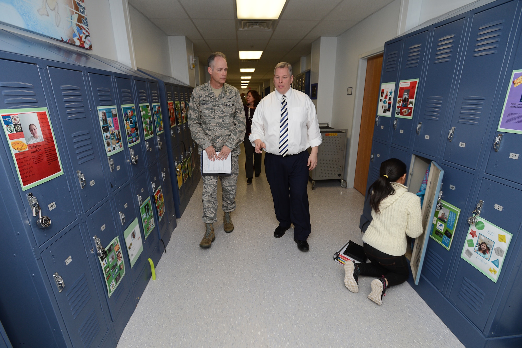 Erich Ledebuhr, Hanscom Middle School principal, shows Col. Michael A. Vogel, 66th Air Base Group commander, around Hanscom Middle School during a tour of the school’s temporary facility on Hanscom Air Force Base Dec. 8. The middle school is scheduled to operate in these facilities until the 2016-2017 school year. The primary school will then occupy these structures while their school is being renovated. (U.S. Air Force photo by Jerry Saslav)