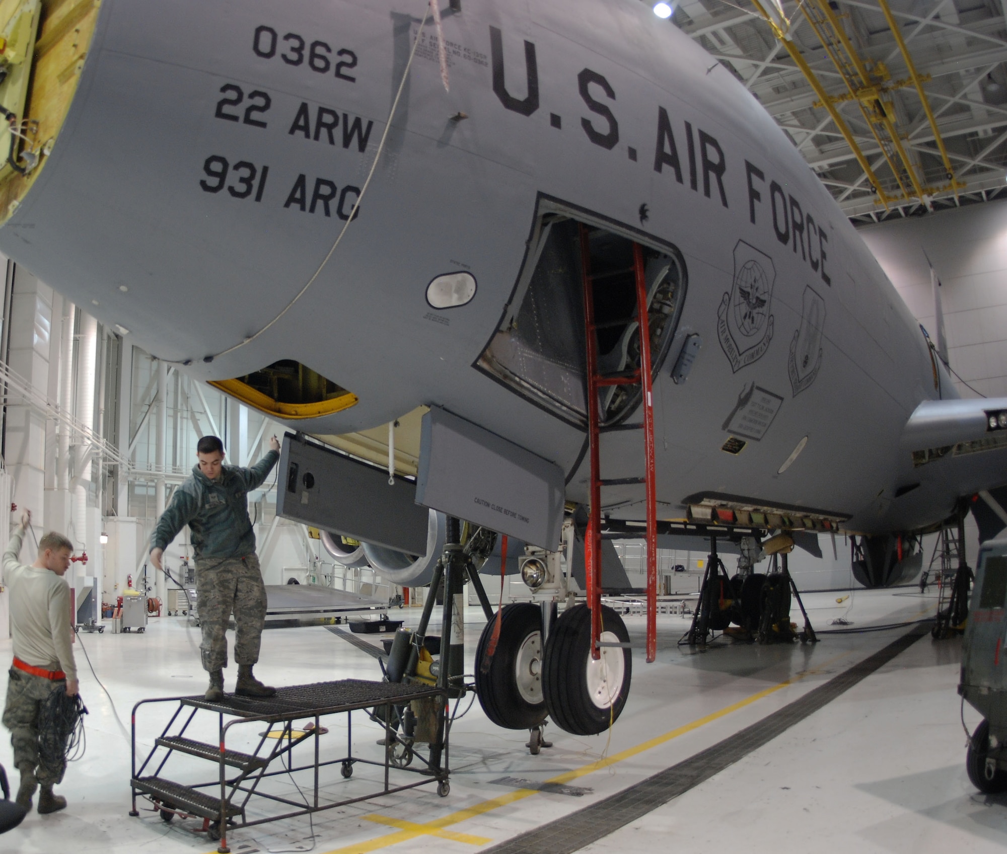 Airmen from the 931st Maintenance Squadron perform a periodic inspection on a KC-135 Stratotanker during the December Unit Training Assembly, McConnell Air Force Base, Kan., Dec. 7, 2014.  A repair to the landing gear actuator made lifting the aircraft part of the inspection.  (U.S. Air Force photo by Tech. Sgt. Abigail Klein)