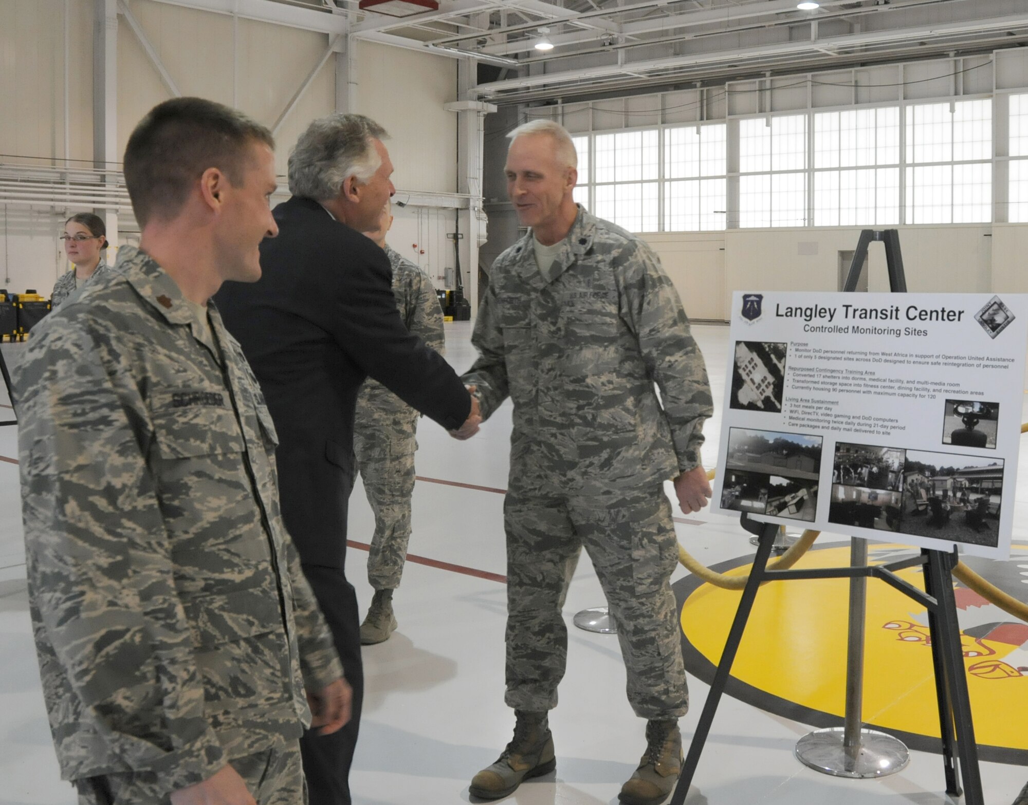 Virginia Gov. Terry McAuliffe greets Lt. Col. Michael Renforth, Virginia Air National Guard’s 192D Fighter Wing, during a visit to Langley Air Force Base, Va., Dec. 2, 2014. McAuliffe, the 72nd governor of Virginia, spoke with Airmen to understand their involvement in maintaining the mission capabilities of the installation. (U.S. Air Force photo by Master Sgt. Carlos J. Claudio/Released))