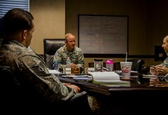 Col. Jeffrey DeVore, Joint Base Charleston commander, sits with supervisors from the 628th Security Forces Squadron Dec. 5, 2014, at JB Charleston.  The intent of the session was to discuss issues facing Team Charleston and building trust among leadership. (U.S. Air Force photo / Senior Airman Tom Brading)