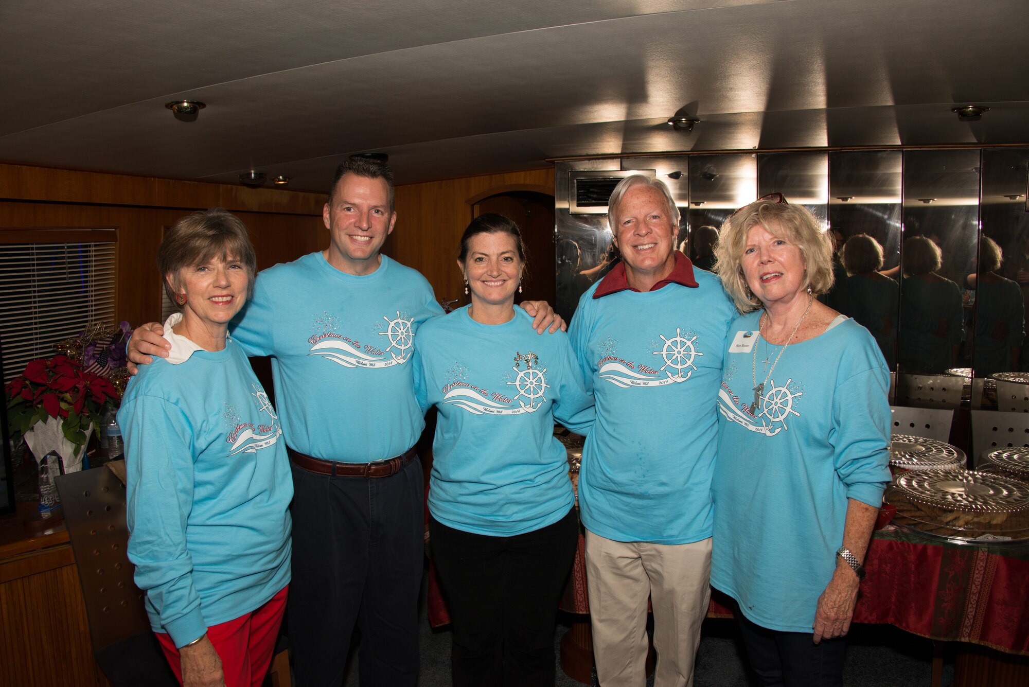 Carol Hayes-Davis; Brig. Gen. Patrick Higby, 81st Training Wing commander, and his wife; Bertram Davis, president of the Beauvoir Foundation, and Sheri Munter, from the committee for Christmas on the Water, greet each other before the 29th annual Christmas on the Water parade held in Biloxi, Miss. Dec. 6, 2014.  The boats, which parade along the gulf coast in full holiday décor, are judged by originality of theme, complexity of design, and overall appearance. Higby and his wife; Col. Dennis Scarborough, 81st TRW vice commander, and Maj. Carla Gleason, 81st TRW Public Affairs officer, were judges for the event.  (U.S. Air Force photo by Marie Floyd)