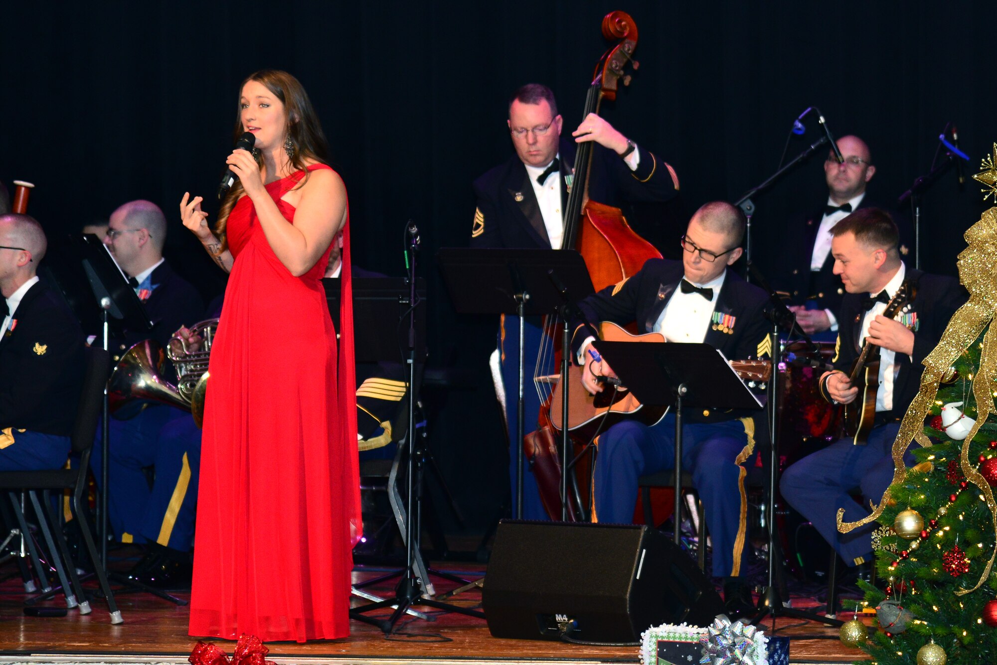 U.S. Army Sgt. Megan Van Oudenaren, Training and Doctrine Command Band vocalist, sings alongside Patriot Thistle, the band’s folk ensemble, during the “Celebrate the Holidays!” concert series at Fort Eustis, Va., Dec. 7, 2014. The band performed more than 15 holiday medleys, several of which featured Van Oudenaren, Patriot Thistle and other ensembles. (U.S. Air Force photo by Senior Airman Aubrey White/Released)