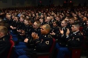 U.S. Army Soldiers assigned to the 128th Aviation Brigade and other concert-goers applaud during the Training and Doctrine Command Band’s “Celebrate the Holidays!” concert series at Fort Eustis, Va., Dec. 7, 2014. The event coincided with the band’s mission of fostering Soldier and family morale and “Telling the Army Story” to the civilian community. (U.S. Air Force photo by Senior Airman Aubrey White/Released)