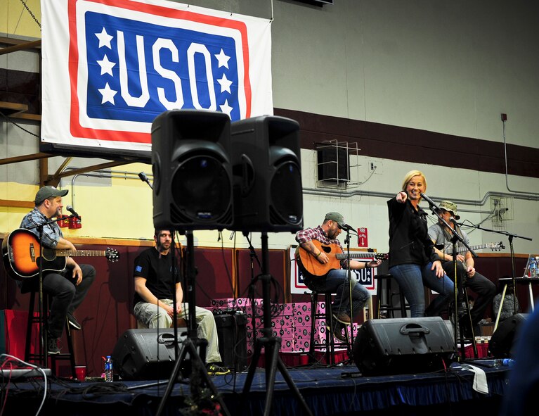Country singer Kellie Pickler performs with her band during a United Service Organizations holiday tour Dec. 8, 2014, at Incirlik Air Base, Turkey. This performance is part of an ongoing USO tradition of partnering with senior leaders and celebrity entertainers to bring a touch of home to troops serving abroad during the holiday season. (U.S. Air Force photo by Airman Cory W. Bush/Released)