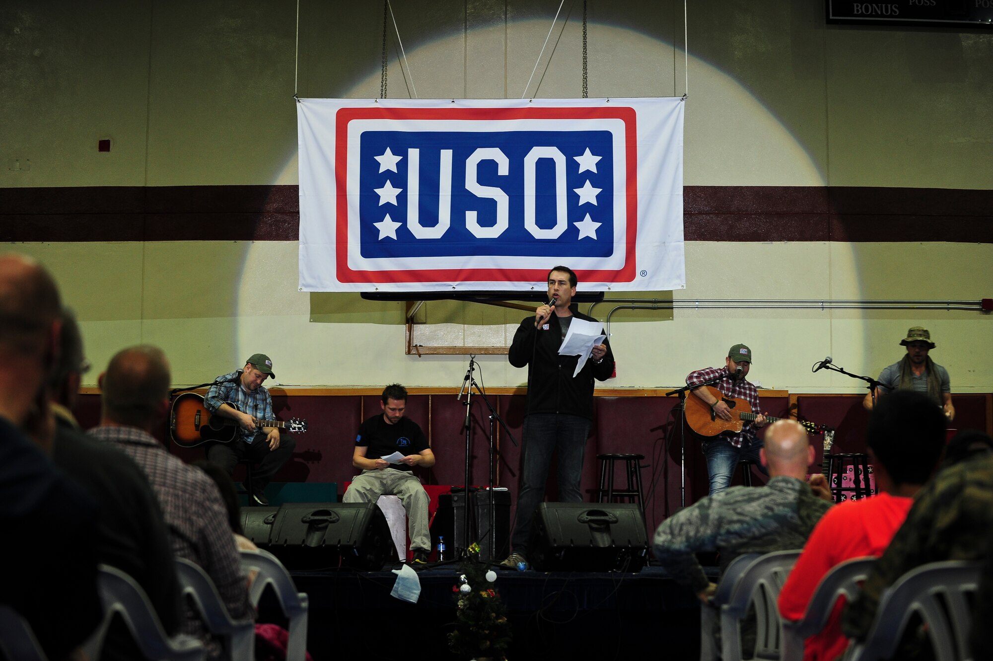 Actor and comedian Rob Riggle performs during a United Service Organizations holiday tour Dec. 8, 2014, at Incirlik Air Base, Turkey. Riggle served 23 consecutive years in the U.S. Marines Corps Reserve as a Public Affairs Officer. (U.S. Air Force photo by Airman Cory W. Bush/Released)