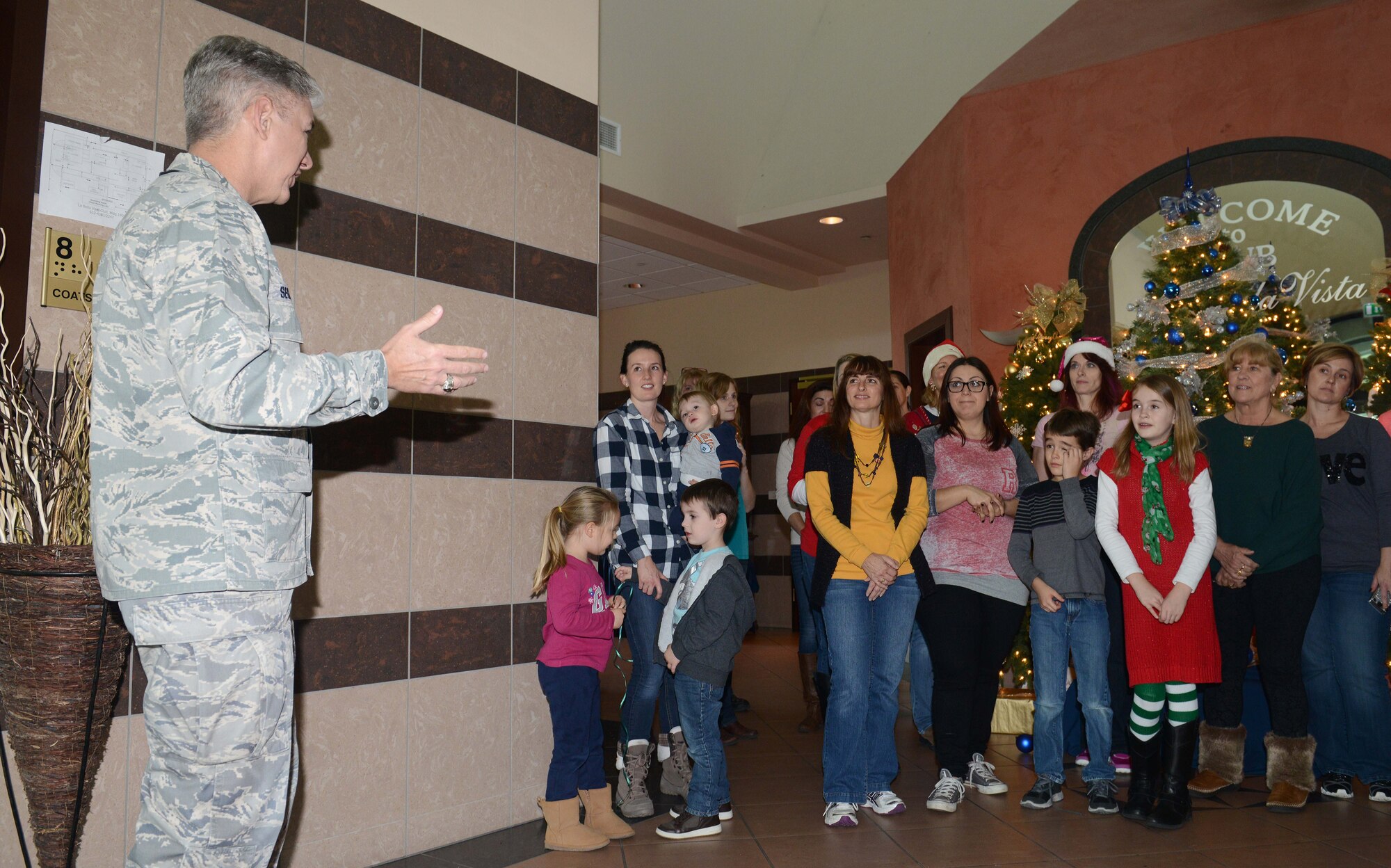 Brig. Gen. Barre Seguin, 31st Fighter Wing Commander, speaks to volunteers during the Aviano Cookie Drive, Dec. 8, 2014, at Aviano Air Base, Italy. More than 35 volunteers gathered during this year’s drive to sort and package more than 16,800 cookies for Aviano Airmen. The drive was hosted by the Aviano Officers and Civilians Spouses' Club. (U.S. Air Force photo/Airman 1st Class Deana Heitzman)        