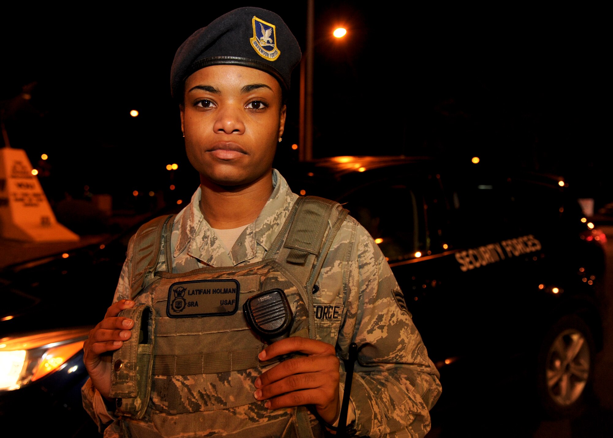 Senior Airman Latifah Holman, 35th Security Forces Squadron alarm monitor, stands in front of a SFS patrol vehicle at Misawa Air Base, Japan, Nov. 20, 2014. As a member of the SFS, she is responsible for enusring the safety of Misawa personnel and equipment. Her daily mission is to monitor the Vindicator alarm system and dispatch emergency services to any unannounced alarms for Protection Level 2, 3 and 4 resources. (U.S. Air Force photo/Staff Sgt. Alyssa C. Wallace)
