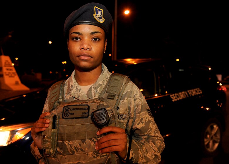 Senior Airman Latifah Holman, 35th Security Forces Squadron alarm monitor, stands in front of a SFS patrol vehicle at Misawa Air Base, Japan, Nov. 20, 2014. As a member of the SFS, she is responsible for enusring the safety of Misawa personnel and equipment. Her daily mission is to monitor the Vindicator alarm system and dispatch emergency services to any unannounced alarms for Protection Level 2, 3 and 4 resources. (U.S. Air Force photo/Staff Sgt. Alyssa C. Wallace)
