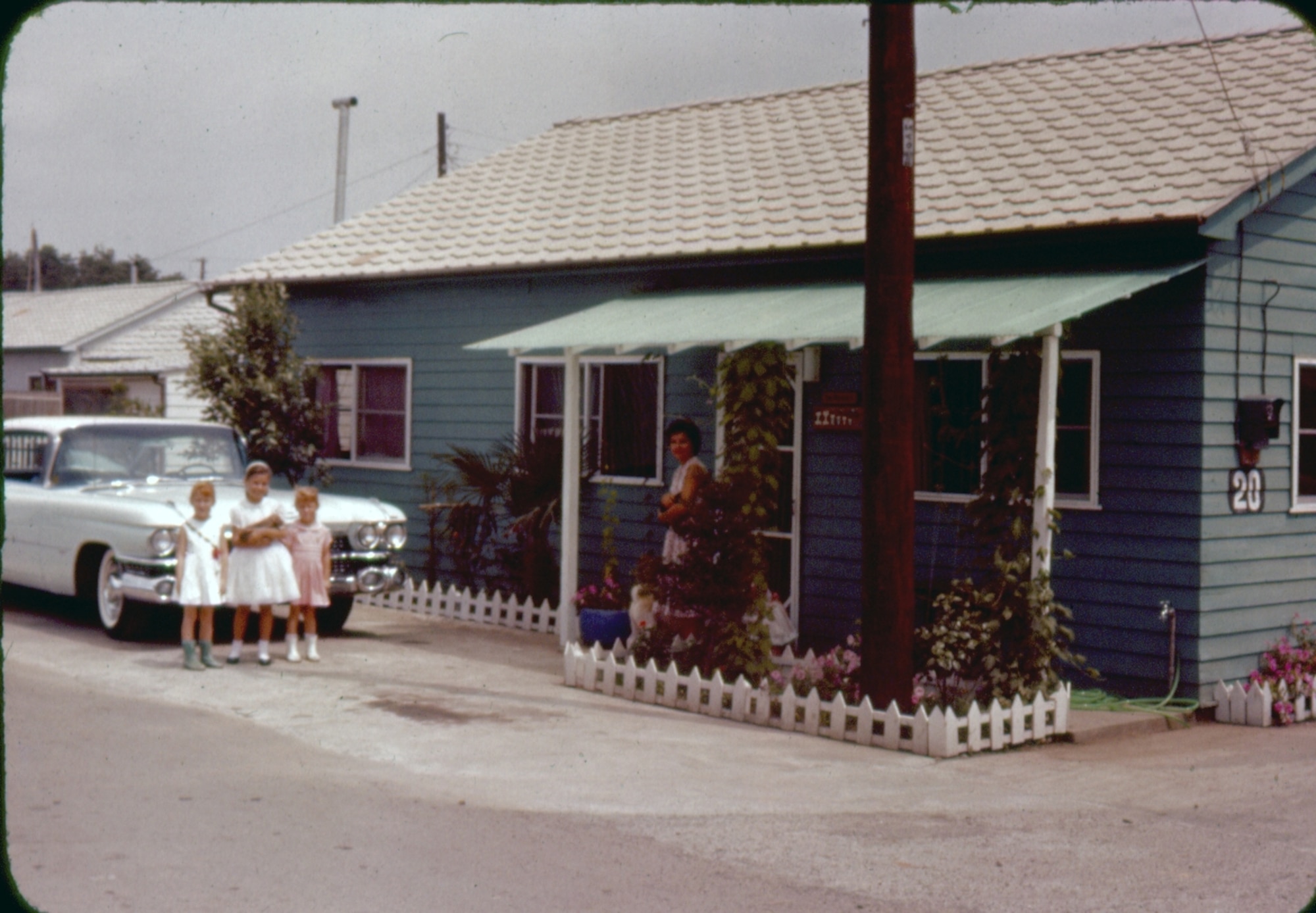 This 1950s-era photo shows an example of an off-base rental house. At the
time Americans were allowed to bring their cars to Japan. (U.S. Air Force photo
courtesy of the 374 Airlift Wing History Office)