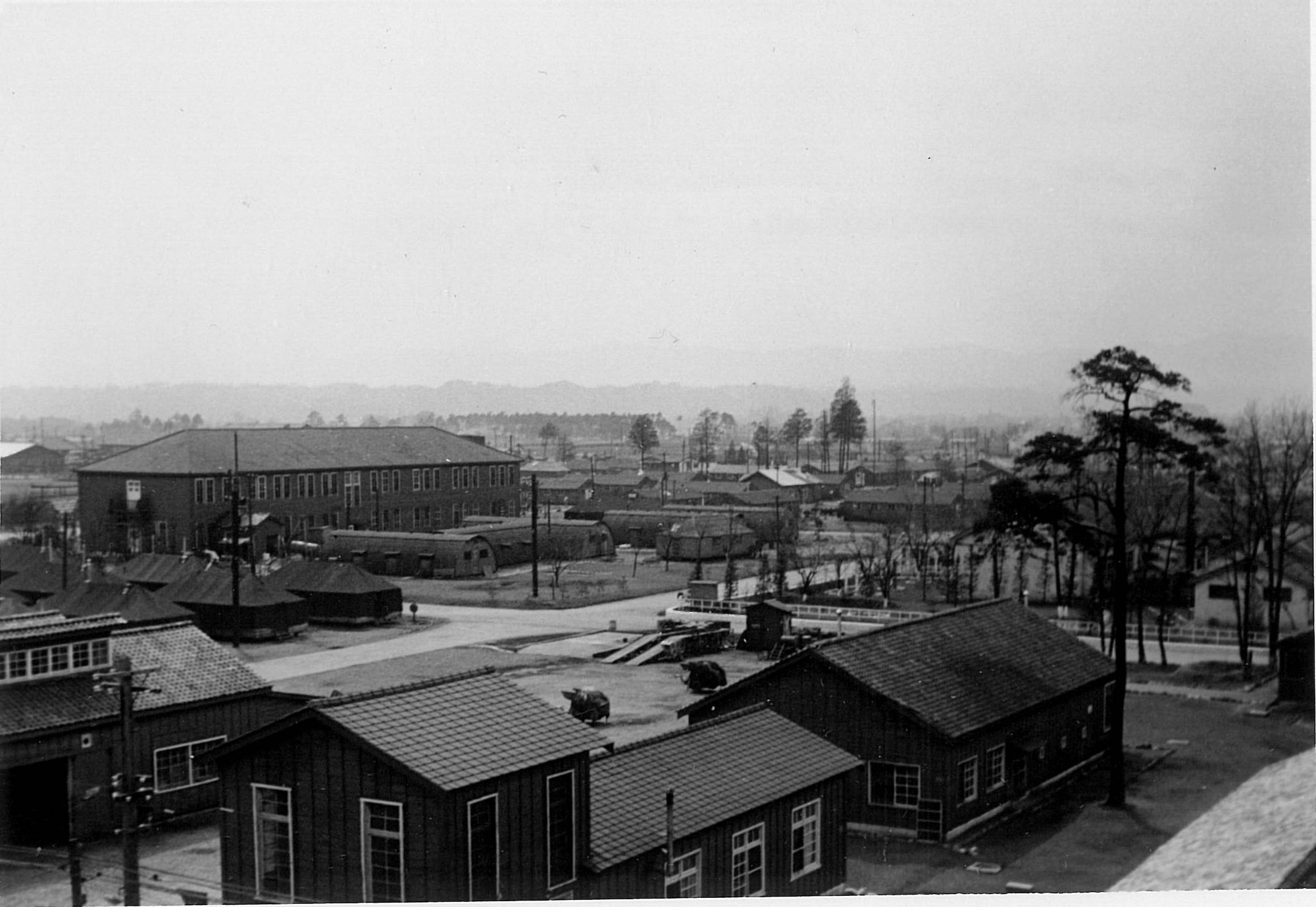 This photo taken in 1954 shows some of the tents and temporary buildings that sprung up on Yokota Air Base in the early 1950's to house deployed personnel.  The location of this image is the general area of the 5th Air Force headquarters today.  (Photo courtesy of Jacob Buck)