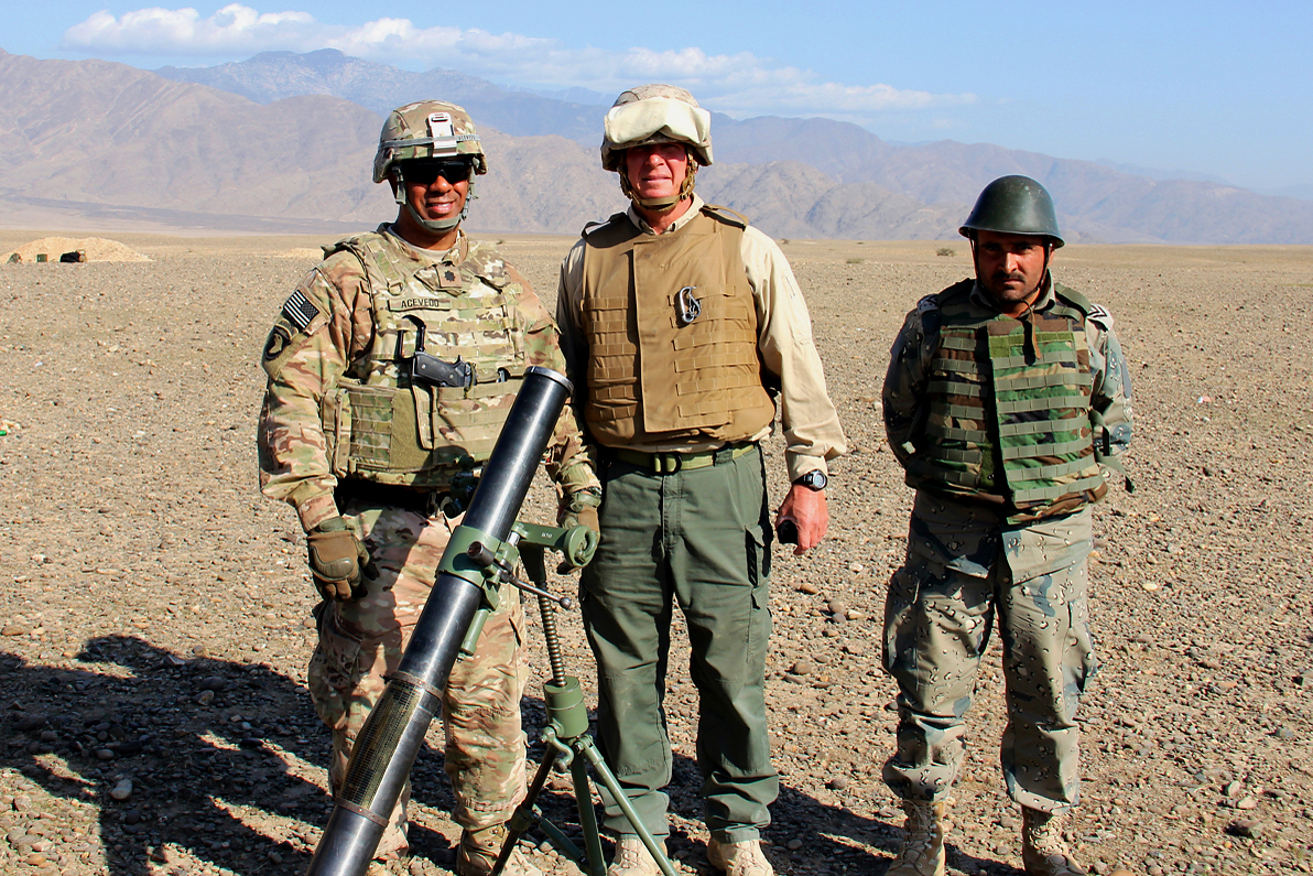 U.s. Army Lt. Col. Acevedo, Left, A Civilian Contractor And An Afghan  Soldier Pose For A