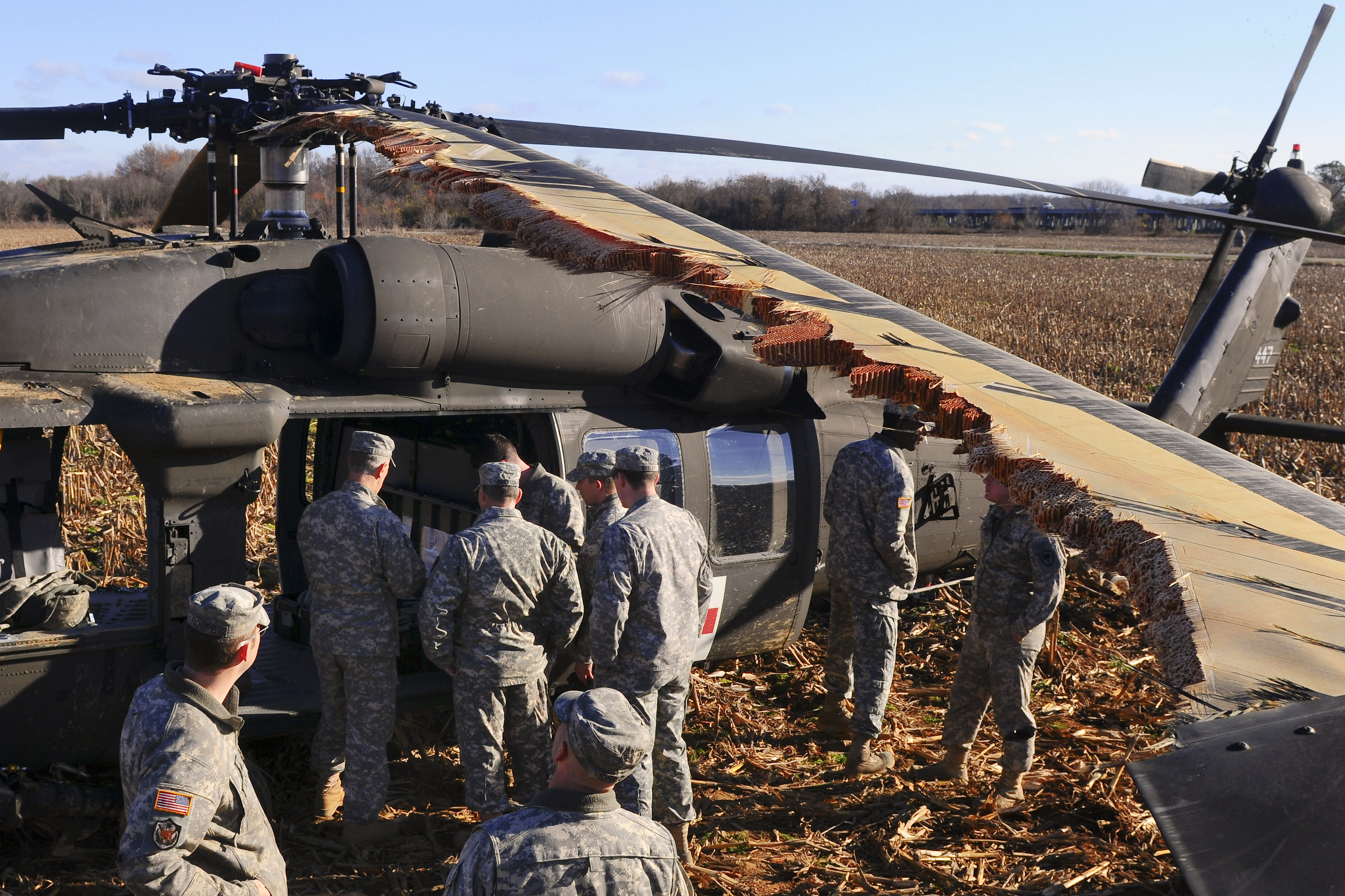 Soldiers prepare a downed UH60 Black Hawk helicopter for slingload