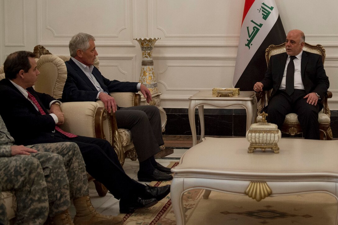 U.S. Defense Secretary Chuck Hagel, center, and U.S. Iraqi Ambassador Stuart Jones, left, meet with Iraqi Prime Minister Haider al-Abadi, right, to discuss matters of mutual importance during a visit to Iraq, Dec. 9, 2014.