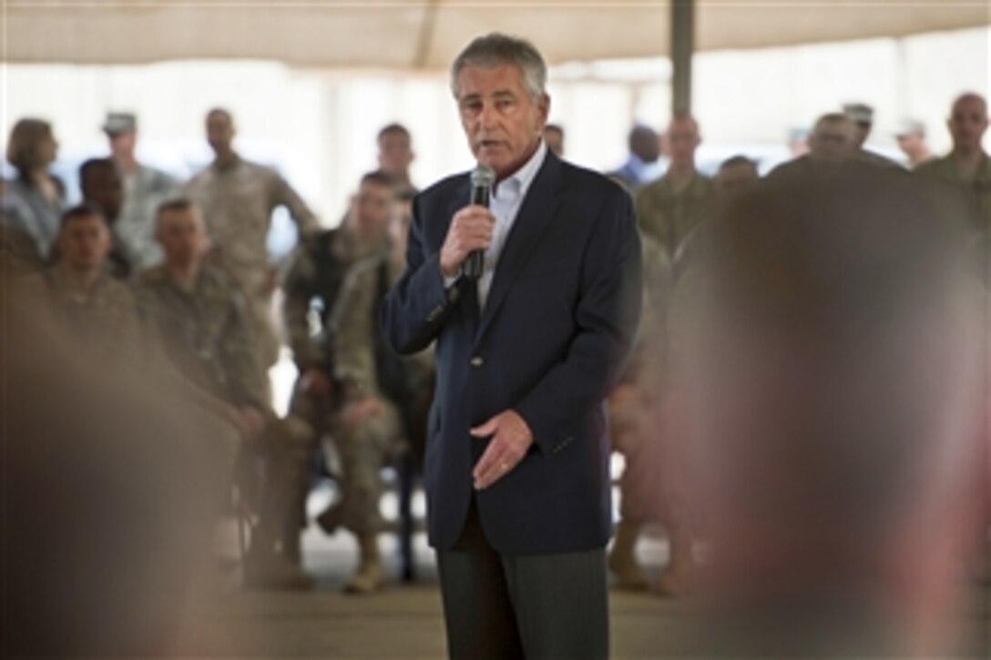 U.S. Defense Secretary Chuck Hagel addresses service members during a visit to Baghdad, Dec. 9, 2014.