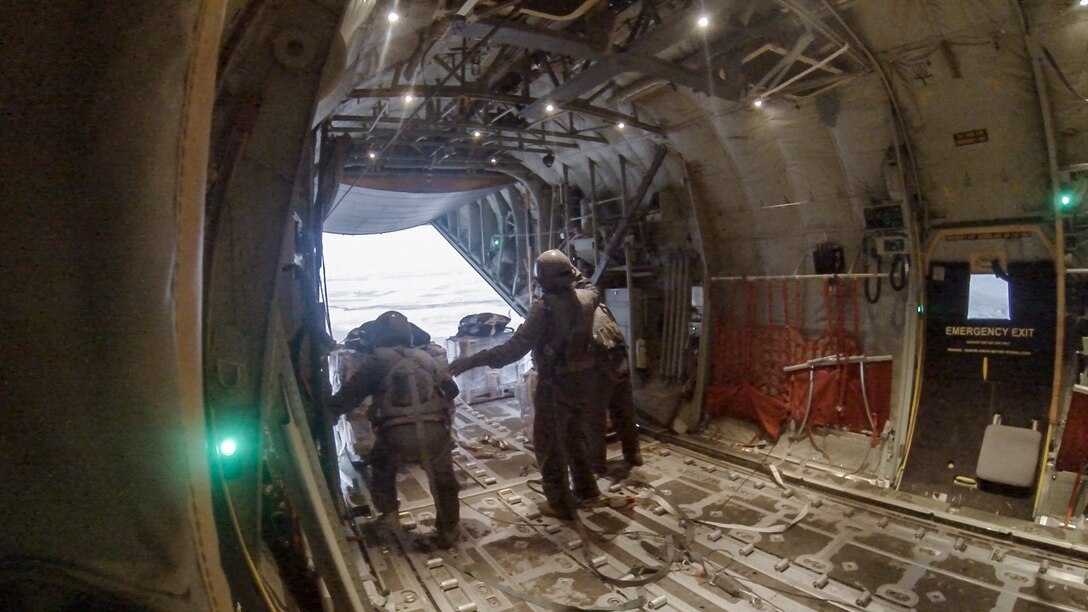 Loadmasters from the Iraqi air force release bundles of food and water from the back of an Iraqi C-130J Super Hercules Aug. 30, 2014. . The Iraqi air force dropped five bundles of food and water to citizens in Amirli, Iraq after working alongside pilots and loadmasters from the United States Air Force’s 737th Expeditionary Airlift Squadron. This mission was the first successful humanitarian aid airdrop conducted solely by the Iraqi air force. (U.S. Air Force photo by Staff Sgt. Jeremy Bowcock/released)