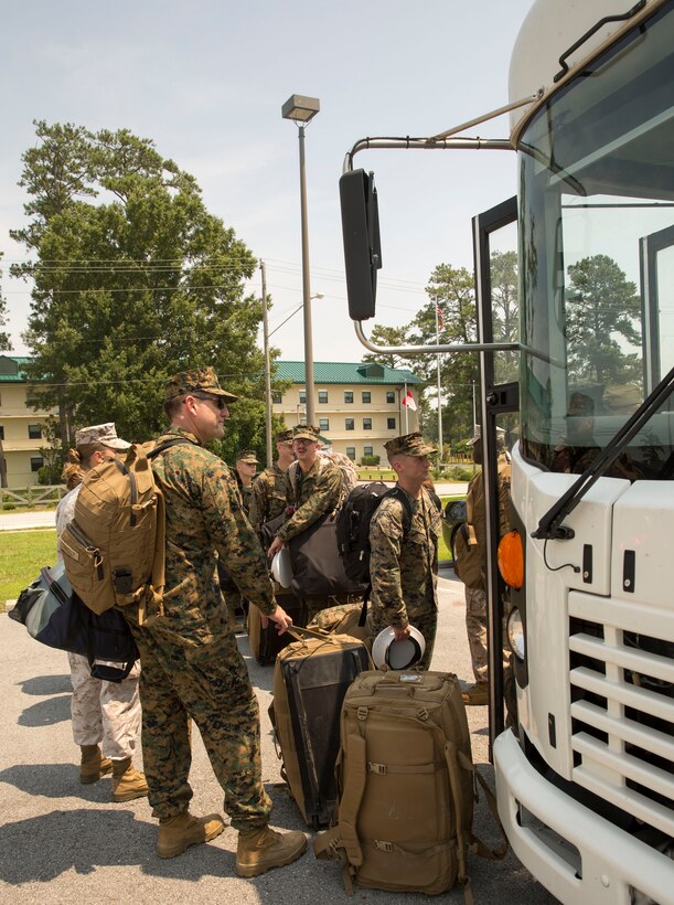 Marines with Marine Operational Test and Evaluation Squadron 22 load onto a bus to begin their trek to the unit’s first deployment, July 9. The Marine Corps Air Station New River Marines deployed to support Special Marine Air Ground Task Force-South aboard USS America on its maiden voyage. The USS America is the first amphibious assault ship of its class.